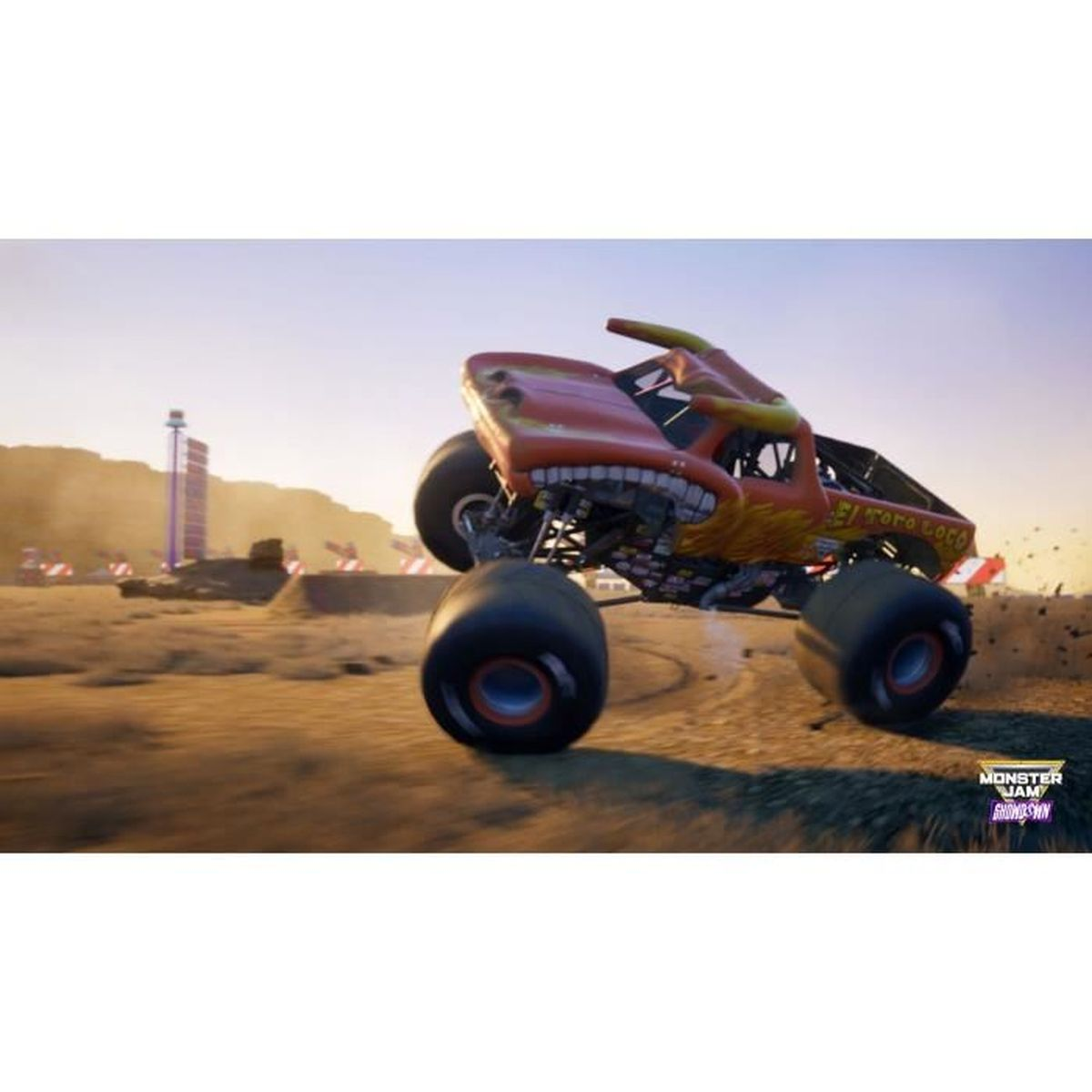 Un monster truck arancione, "El Toro Loco", salta su una pista sterrata. Il cielo è sereno. Il camion ha ruote grandi.