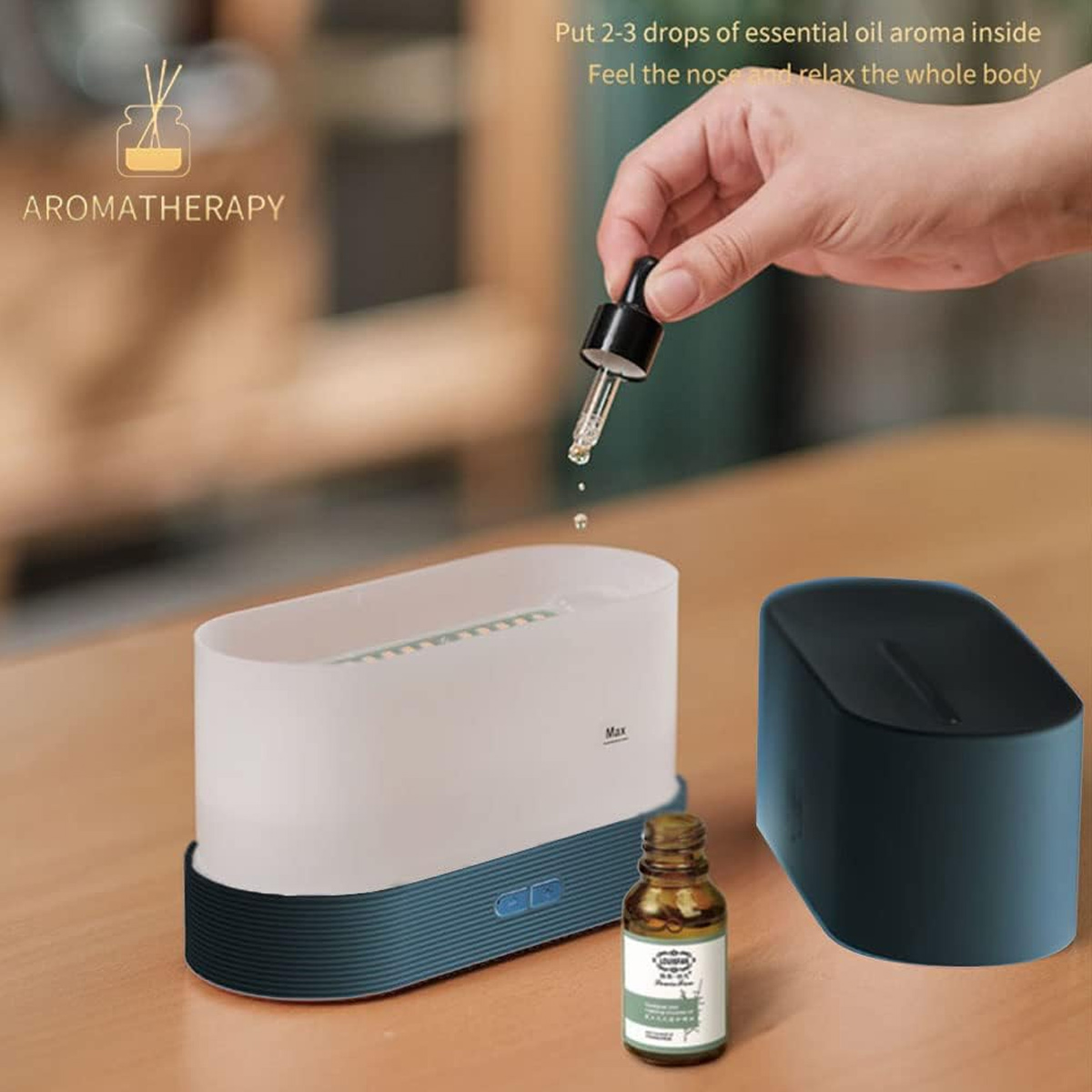 Eine Hand hält eine Pipette über einem Aromatherapie-Diffusor. Eine Flasche ätherisches Öl und ein schwarzer Diffusor sind ebenfalls zu sehen.