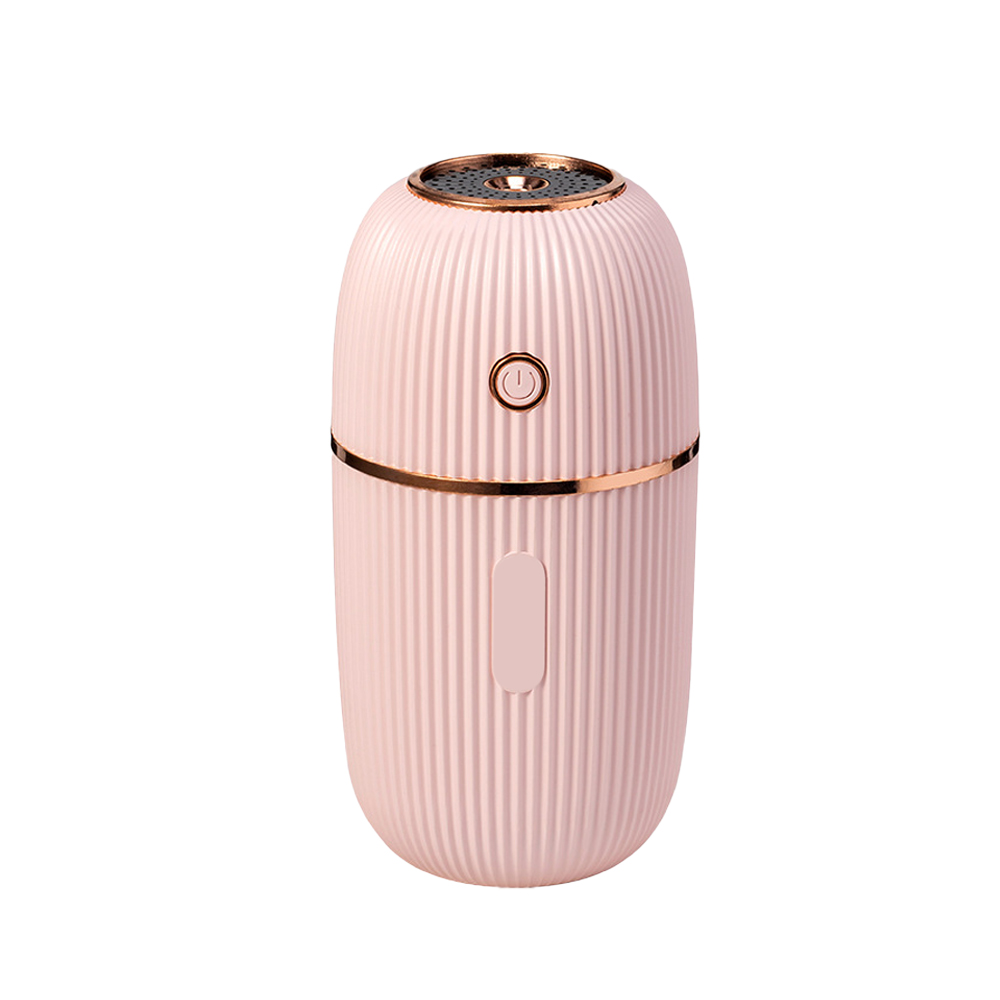 Ein rosa, gerippter, ovaler Luftbefeuchter mit goldener Zierleiste. Er hat einen Ein-/Ausschalter und eine kleine rechteckige Taste.