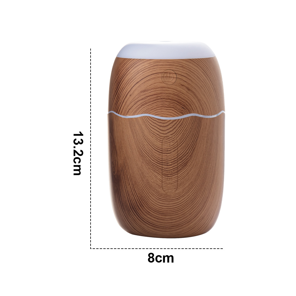 Ein brauner Luftbefeuchter mit Holzmaserung, weißem Deckel und weißer Wellenlinie. Maße: 13,2 cm hoch und 8 cm breit.