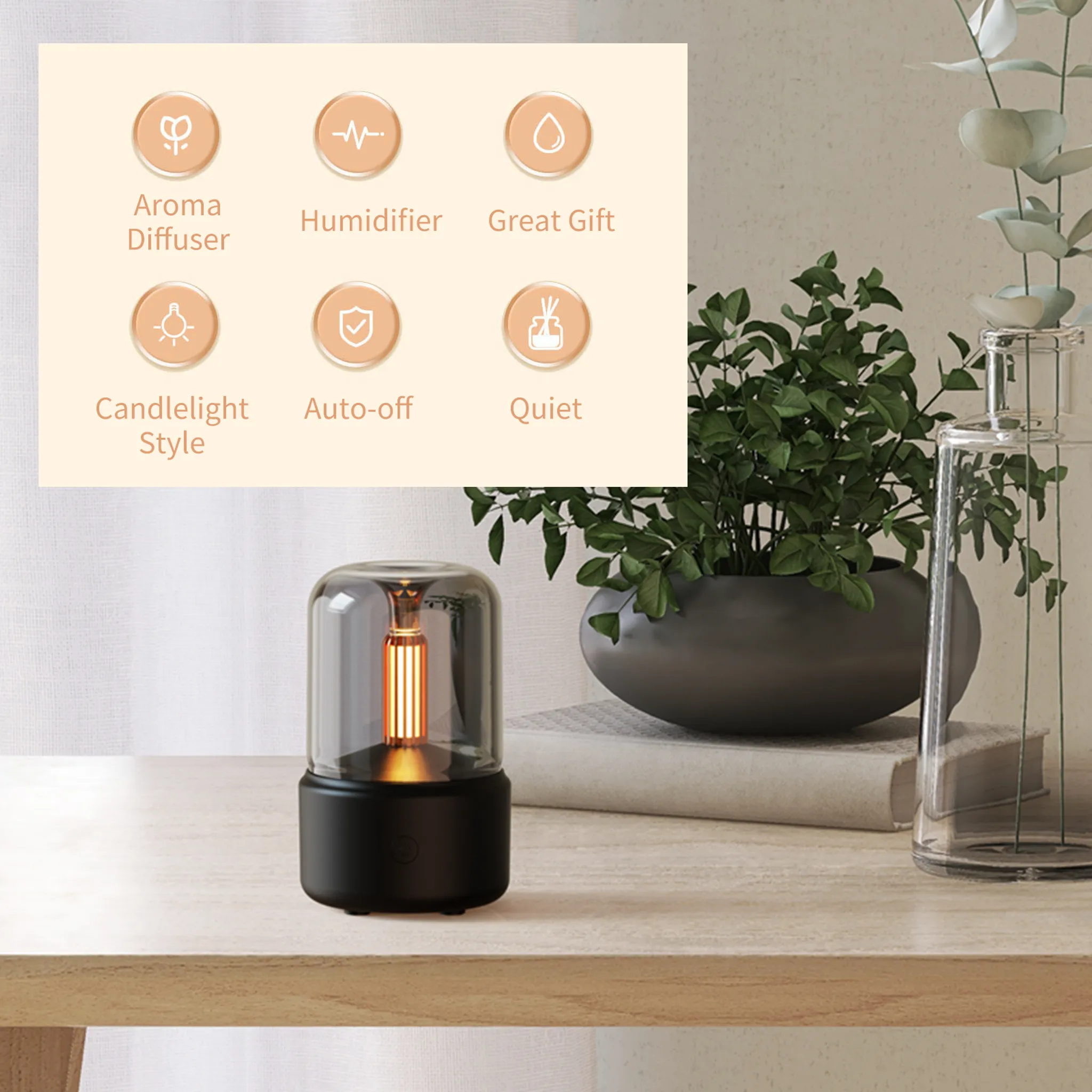 Aromadiffusor mit Symbolen, Pflanze in dunklem Topf, klare Vase mit Blättern, auf einem Holztisch.