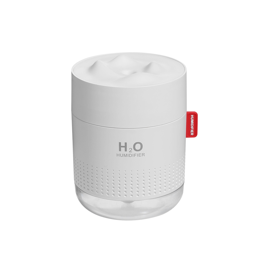 Ein weißer Luftbefeuchter mit transparentem Boden. Er hat H2O und HUMIDIFIER aufgedruckt. Ein rotes Etikett sagt HUMIDIFIER.