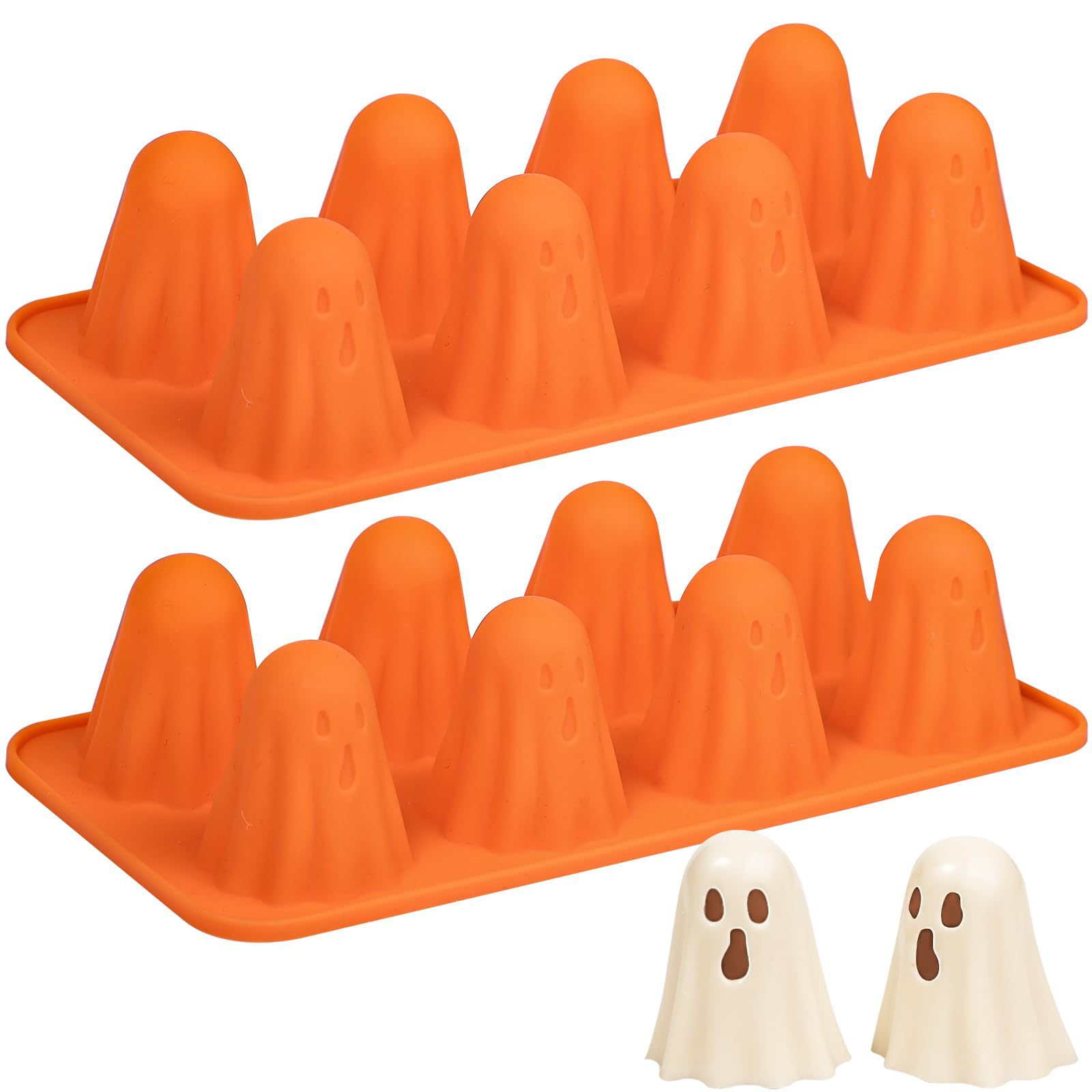 Zwei orangefarbene Silikontabletts mit Geisterformen. Unten sind zwei weiße Geisterformen. Halloween-Thema.