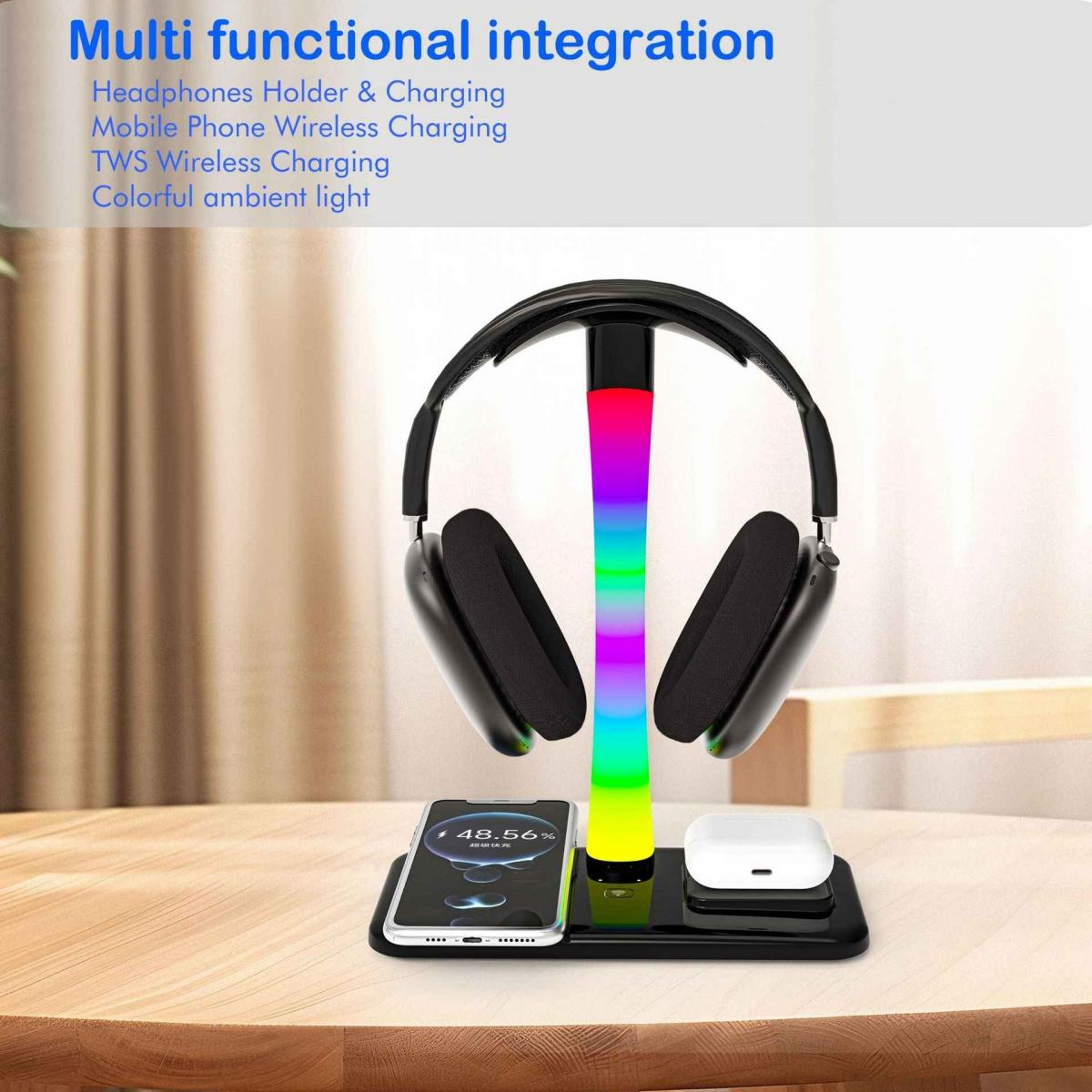 Eine Ladestation mit Kopfhörern, Telefon und Ohrhörern. Es hat ein farbenfrohes Licht und steht auf einem Holztisch. Text: Multifunktionale Integration.