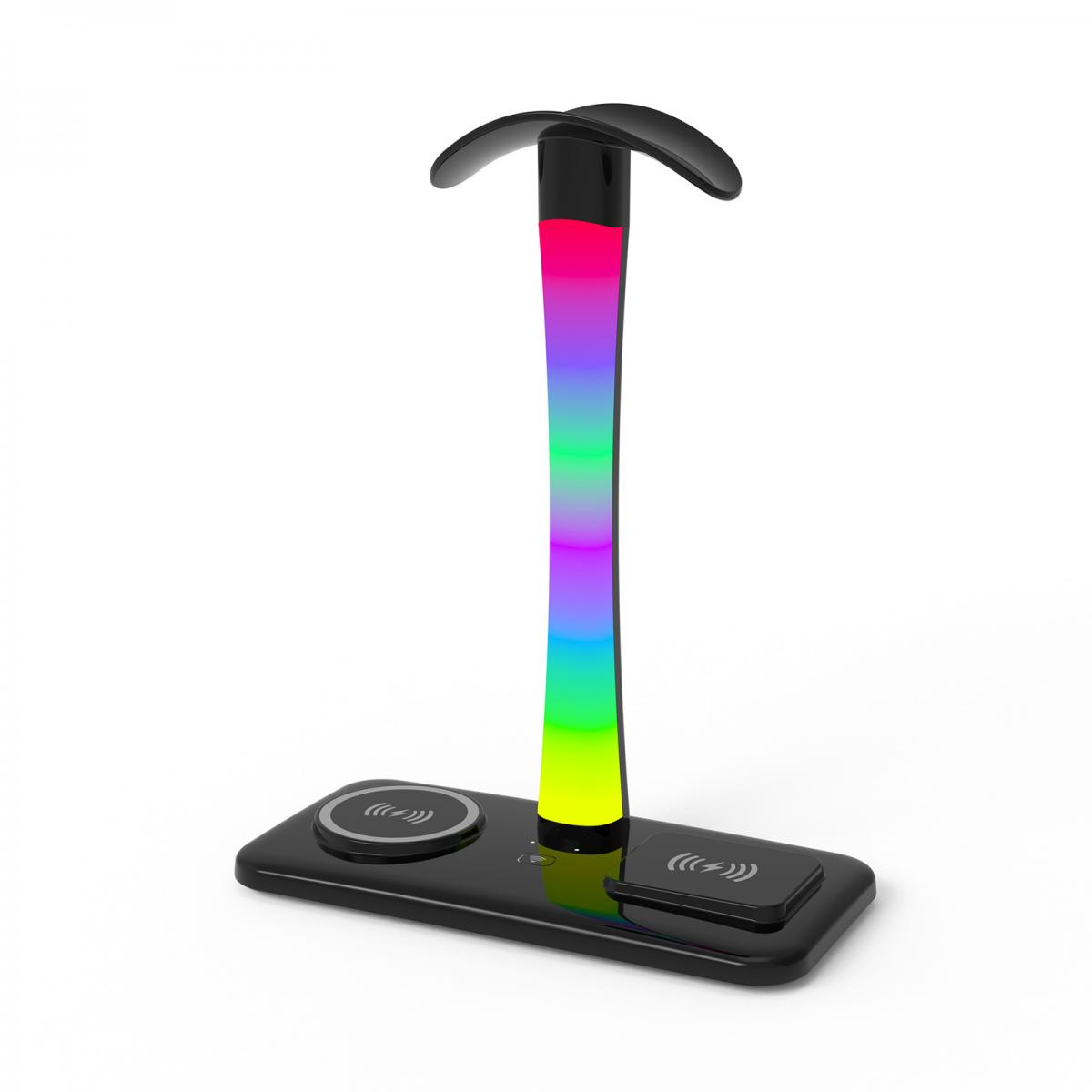 Eine schwarze Lampe mit Regenbogenfarbenem Licht und kabelloser Ladestation auf weißem Hintergrund.