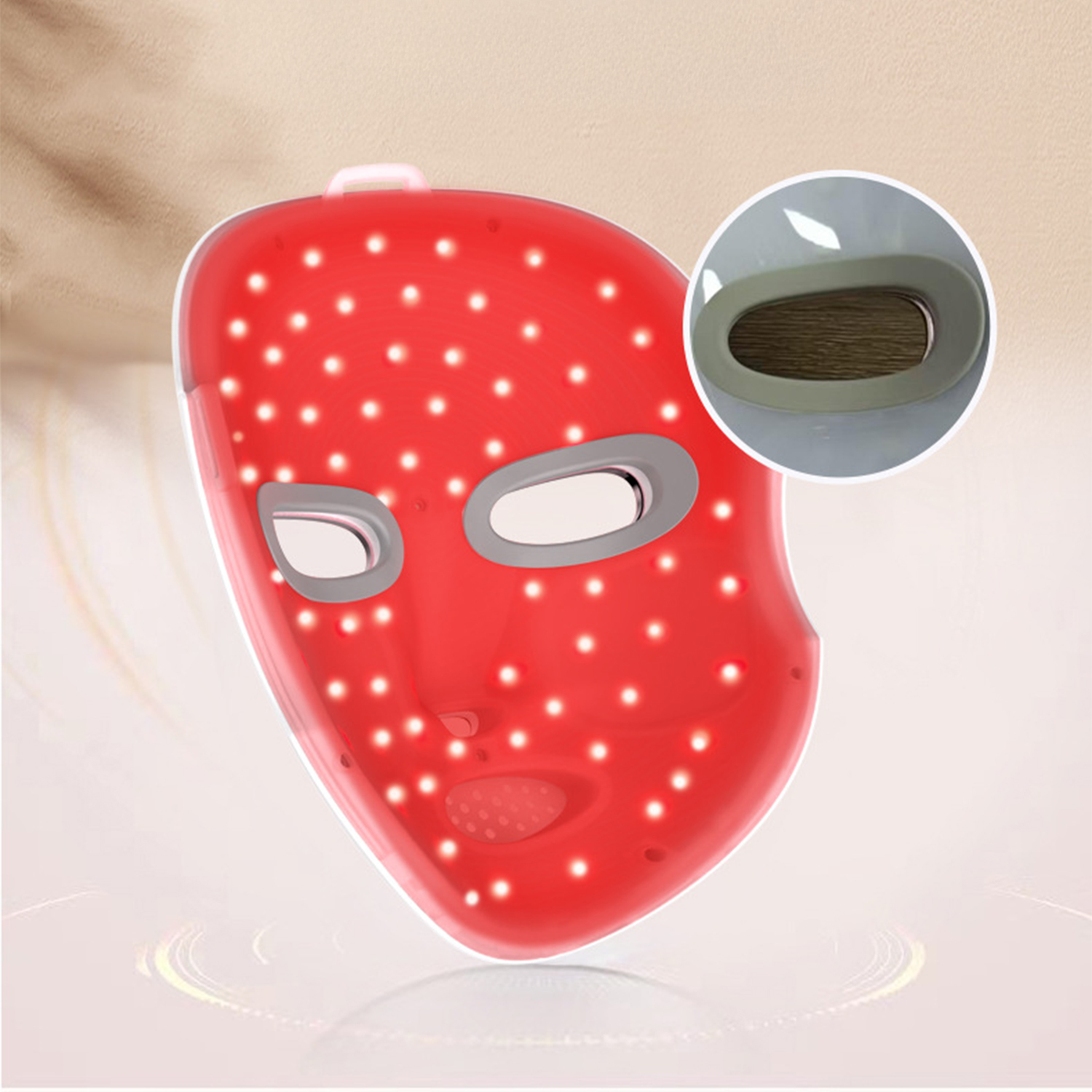 Eine rote LED-Gesichtsmaske mit Augen- und Mundöffnungen. Sie hat viele kleine Lichter und eine kleine Einlage.