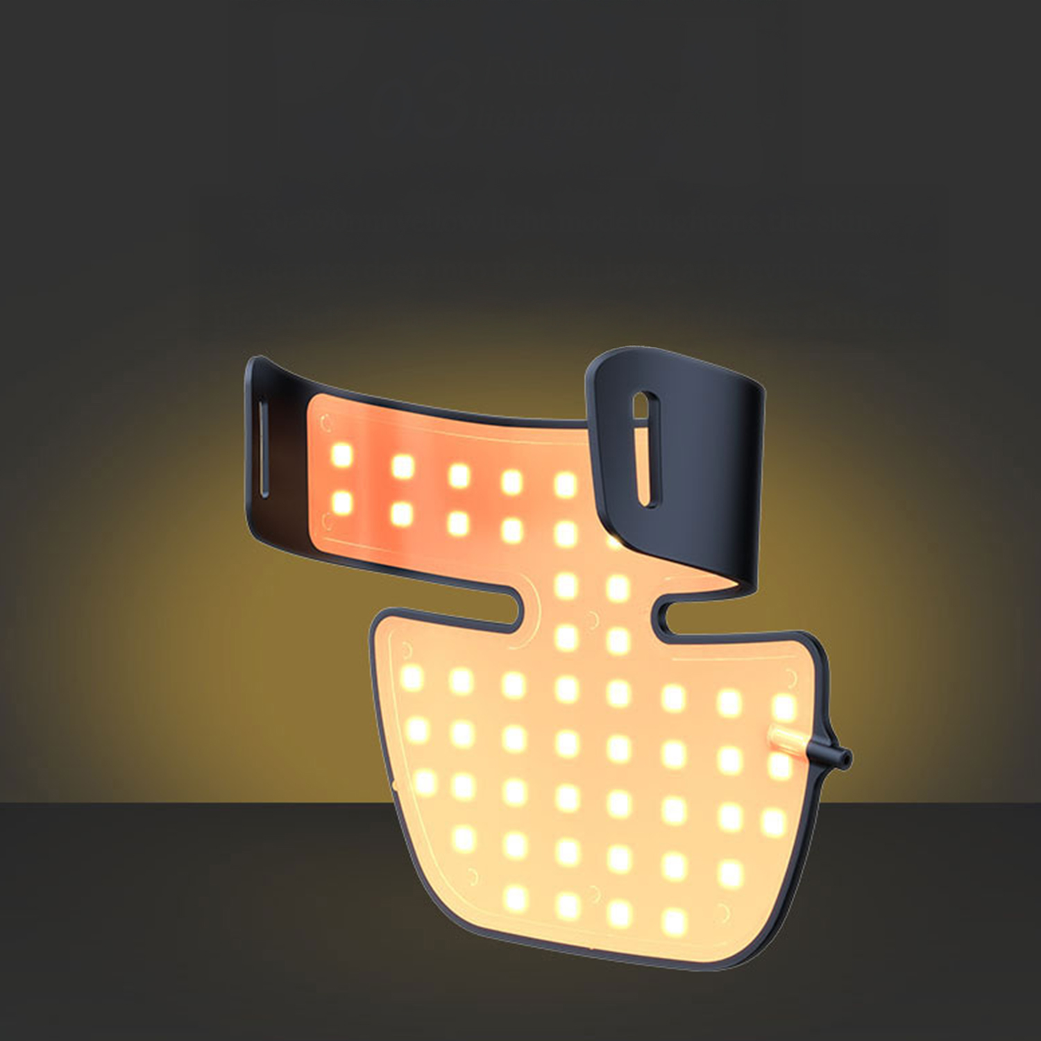 Un dispositivo illuminato a forma di maschera con molte piccole luci. Ha una cornice nera e le luci sono arancioni, su uno sfondo scuro.