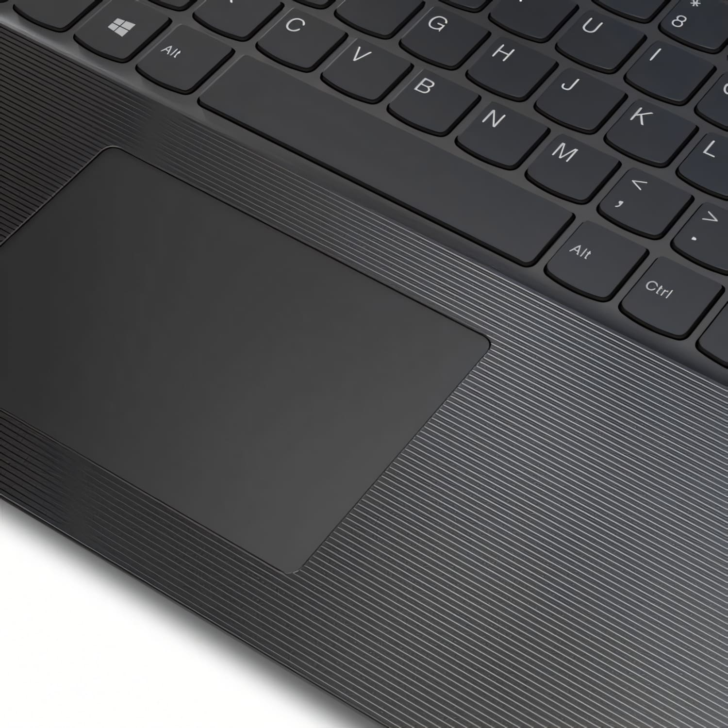 Primer plano de un teclado y un panel táctil de portátil. El teclado es gris oscuro con letras blancas. El panel táctil es liso y negro.