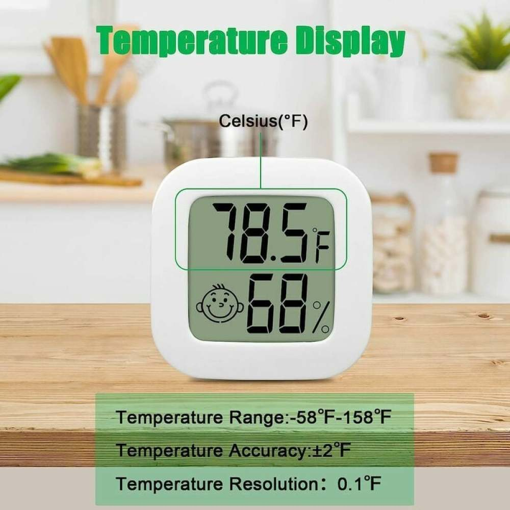 Ein weißes digitales Thermometer zeigt 78,5 °F und 68 % an. Der Hintergrund ist eine Küche mit Holztisch.