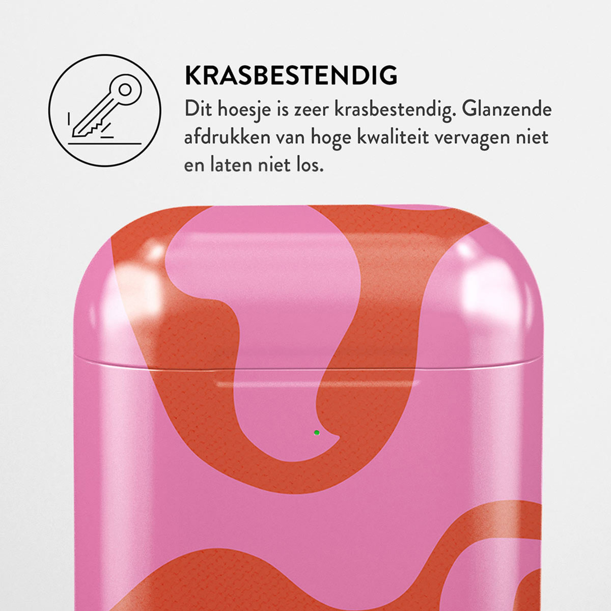 Roze en oranje patroonhoesje. Tekst: KRASBESTENDIG. Een sleutelpictogram is zichtbaar. De tekst zegt dat het krasbestendig is en van hoge kwaliteit.