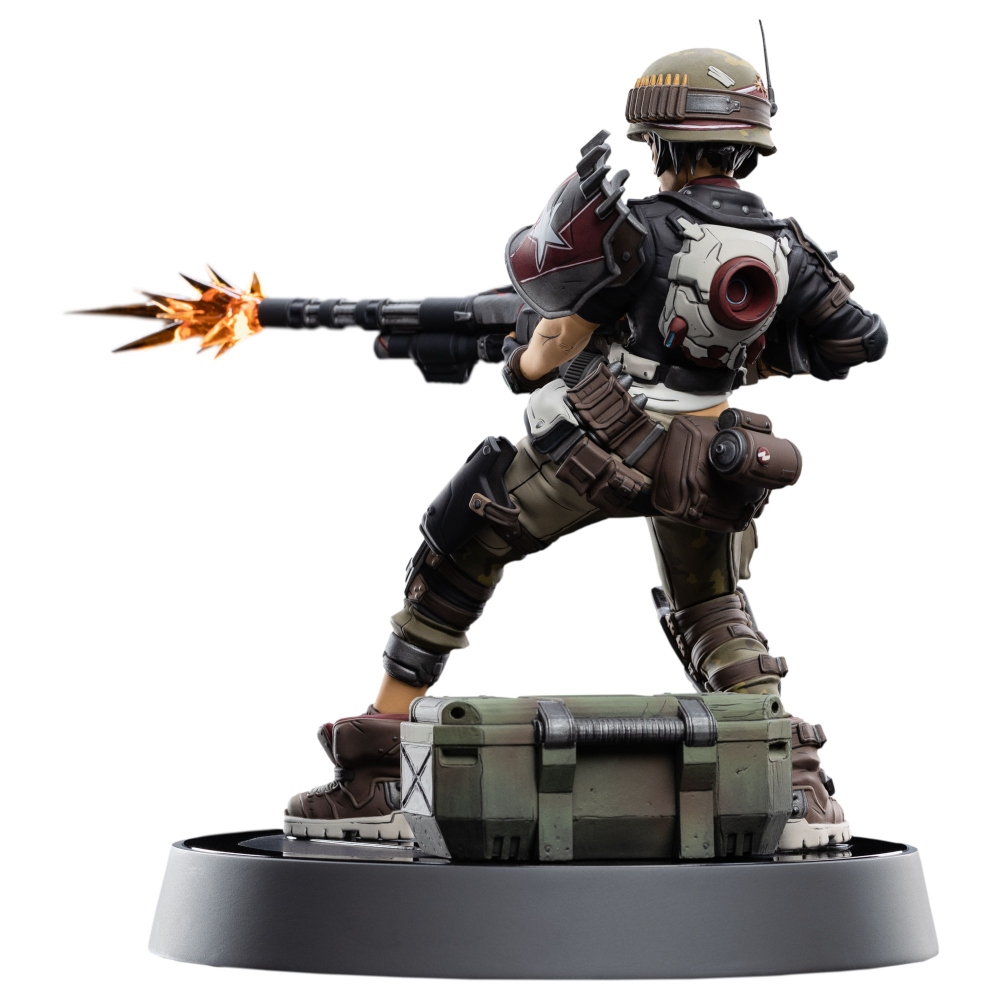 Figur eines Soldaten, der eine Waffe abfeuert. Der Soldat steht auf einer Kiste und trägt Kampfausrüstung. Feuer kommt aus der Waffe.