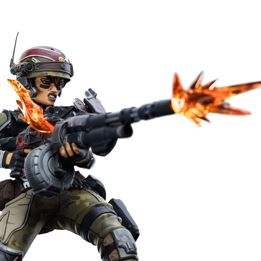 Eine Figur einer weiblichen Figur hält eine große Waffe, aus deren Lauf orangefarbenes Feuer kommt. Sie trägt einen Helm und Kampfausrüstung.