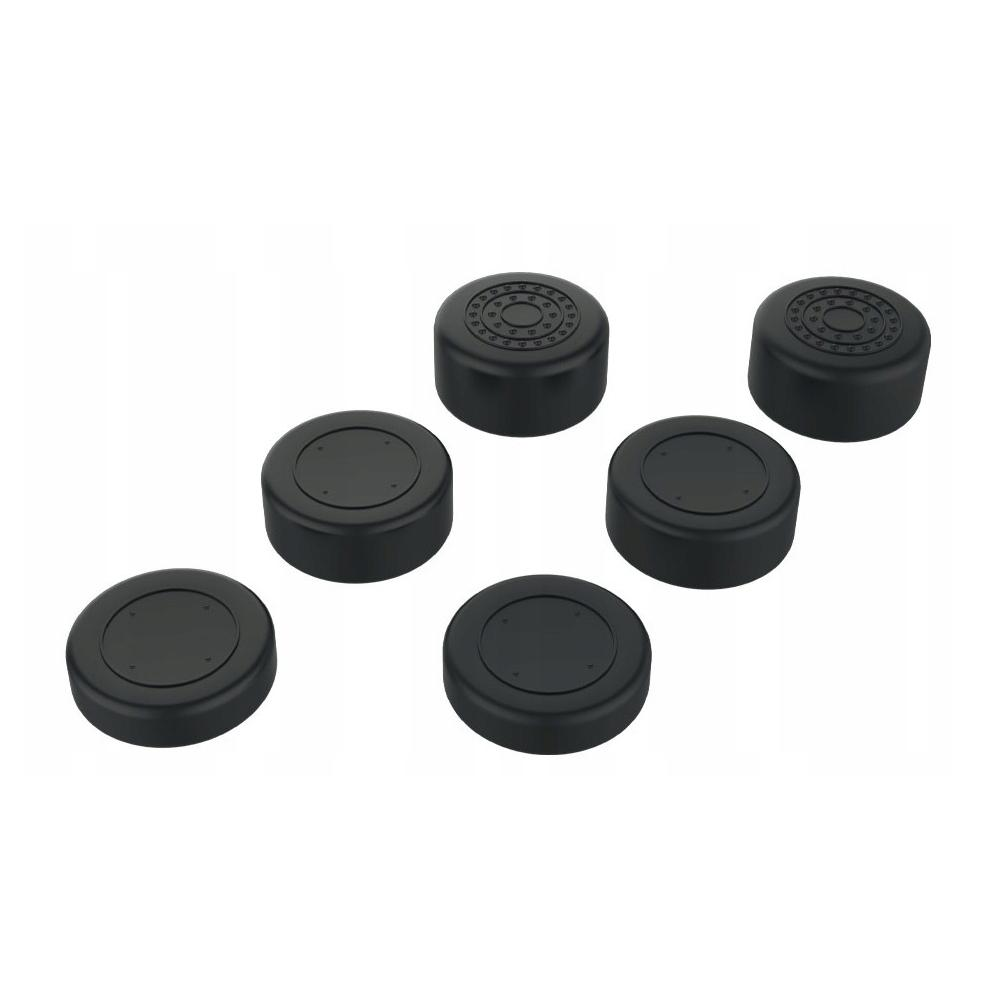Sześć czarnych, okrągłych przedmiotów z centralnym wgłębieniem i teksturowanymi detalami na białym tle.