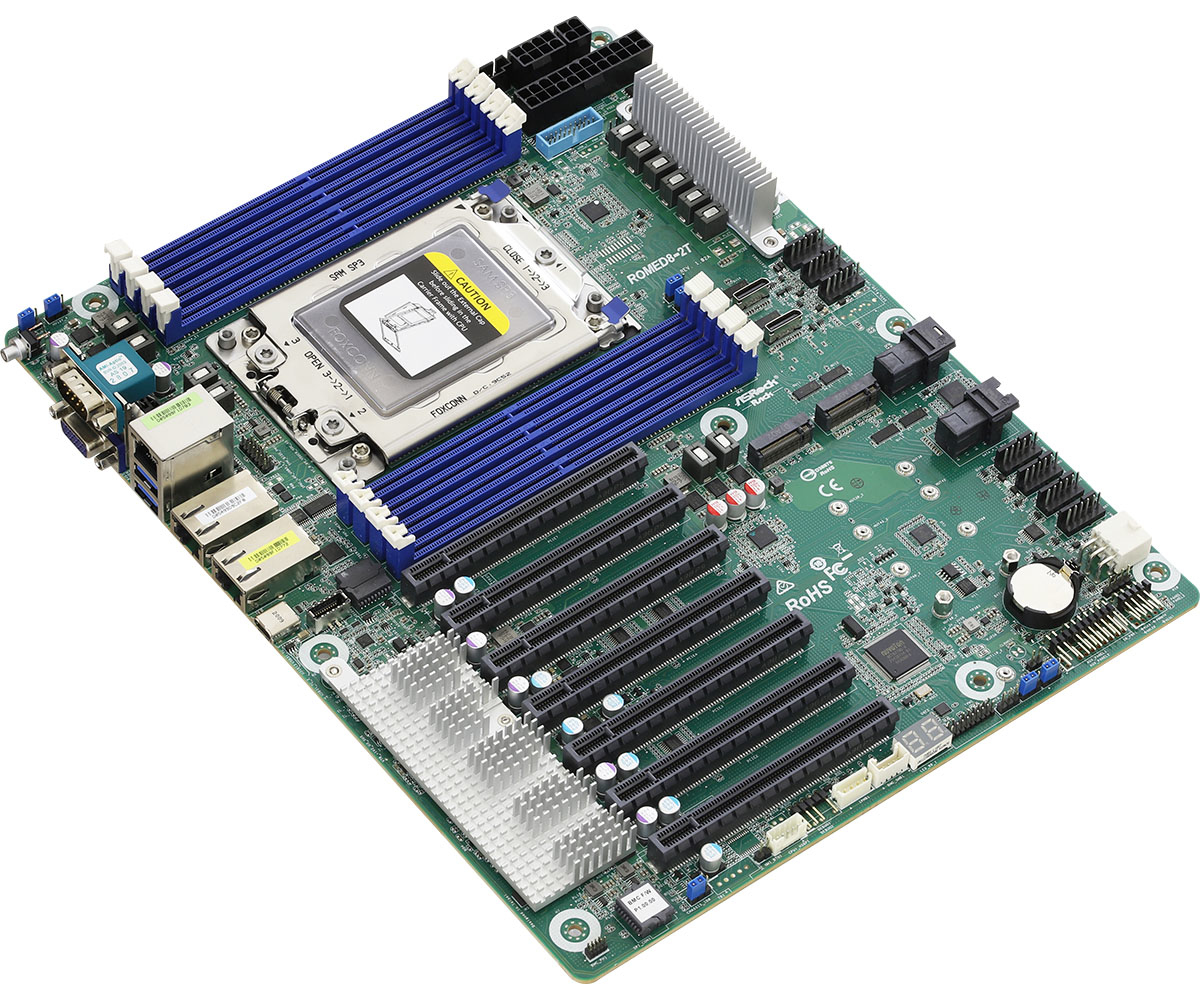 Una scheda madre verde con componenti blu e neri. Ha slot, connettori e un socket CPU. La scheda è etichettata 'ROMED8-2T'.