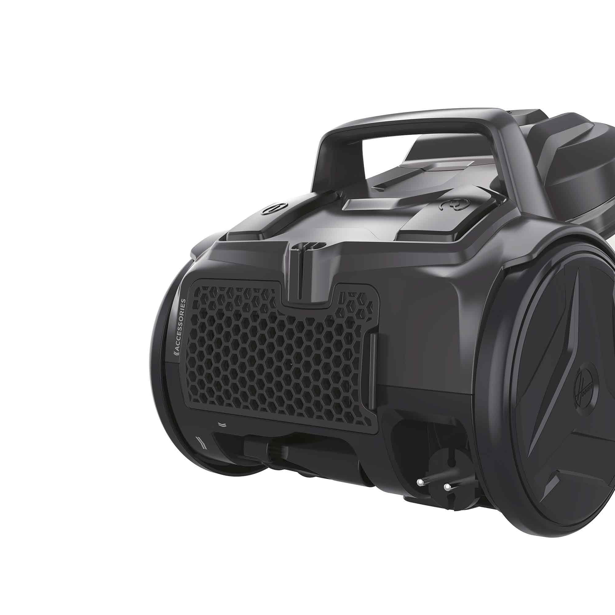 Czarny odkurzacz z uchwytem, kołami i kratką o strukturze plastra miodu. Na białym tle.