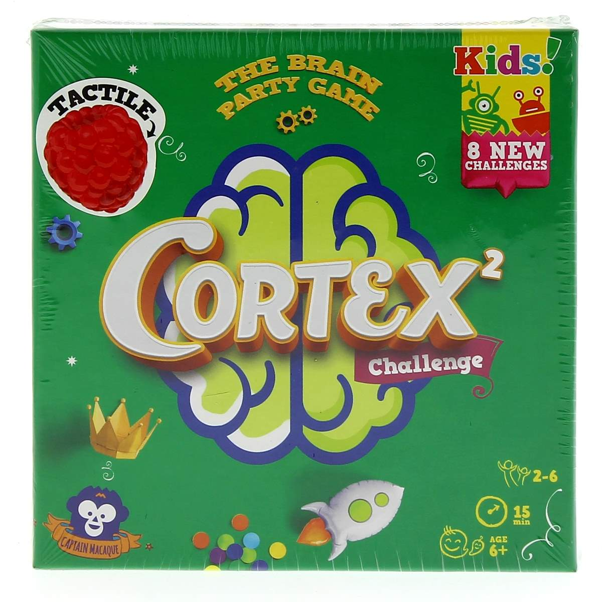 Zielone pudełko gry Cortex. Zawiera słowa Cortex Challenge, Kids i dotykową malinę. Ma rakietę i inne szczegóły gry.