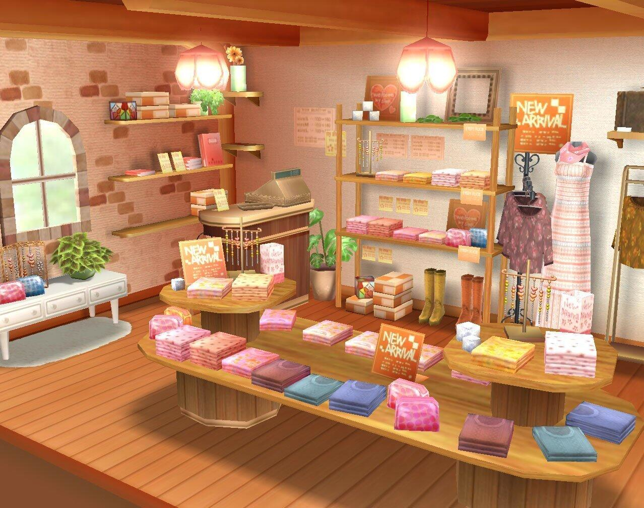 Wnętrze butiku z półkami z ubraniami i akcesoriami, stołami wystawowymi ze złożonymi ubraniami i znakami nowych dostaw.