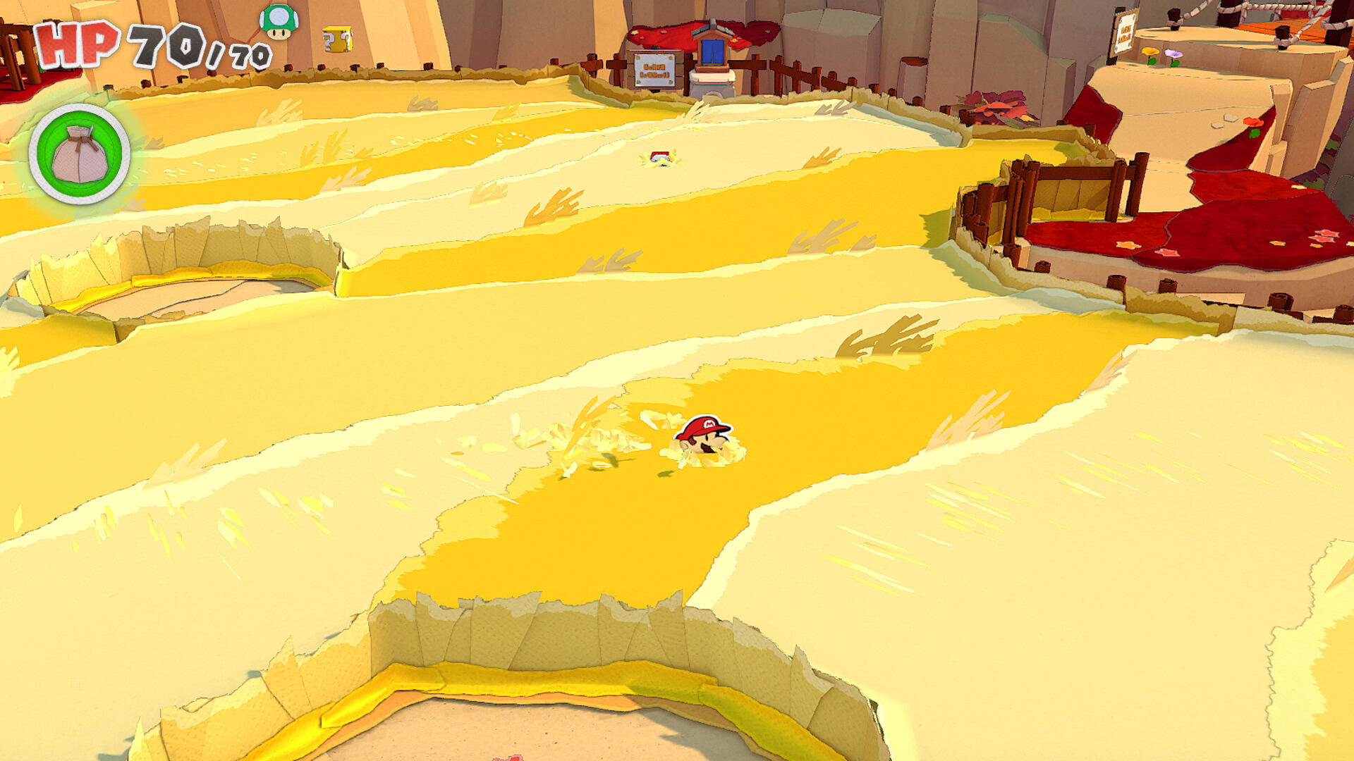 Scena z gry z papierowym Mario w żółtym krajobrazie. Widoczny pasek zdrowia i ikona torby. Tło ma czerwone i brązowe elementy.