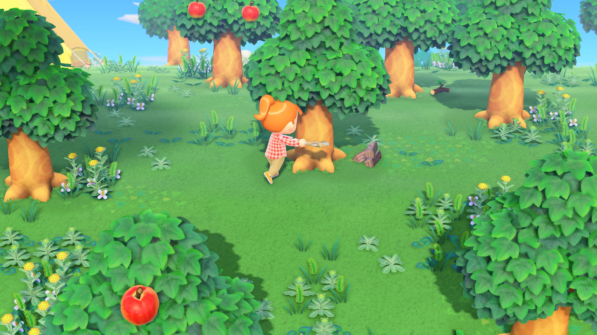 Eine Figur in einem rot karierten Hemd hackt einen Baum in einem Cartoon-Wald mit Äpfeln, Gras, Blumen und blauem Himmel.