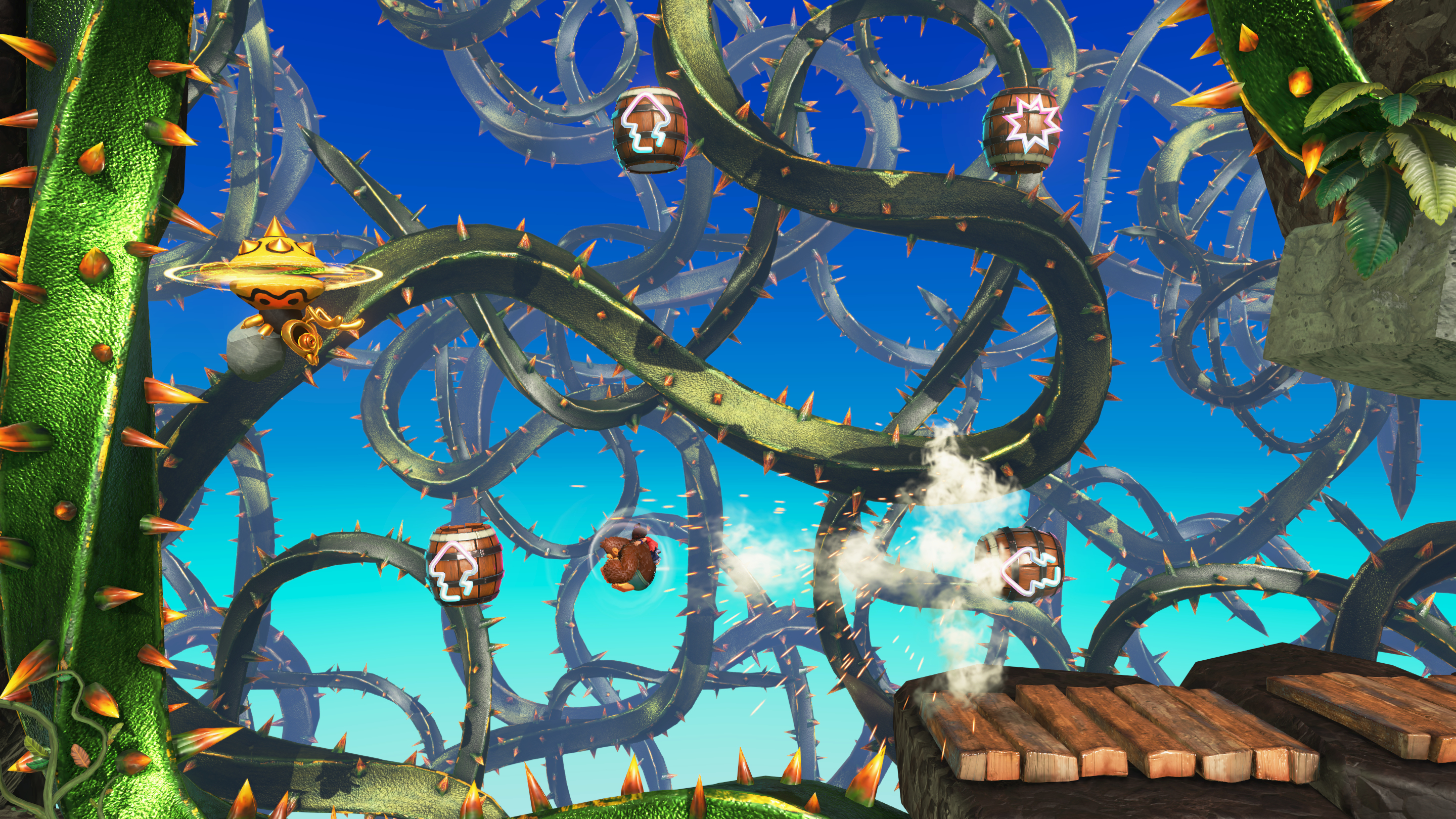 Żywa scena z gry z zielonymi cierniami, beczkami i żółtą postacią na tle błękitnego nieba.