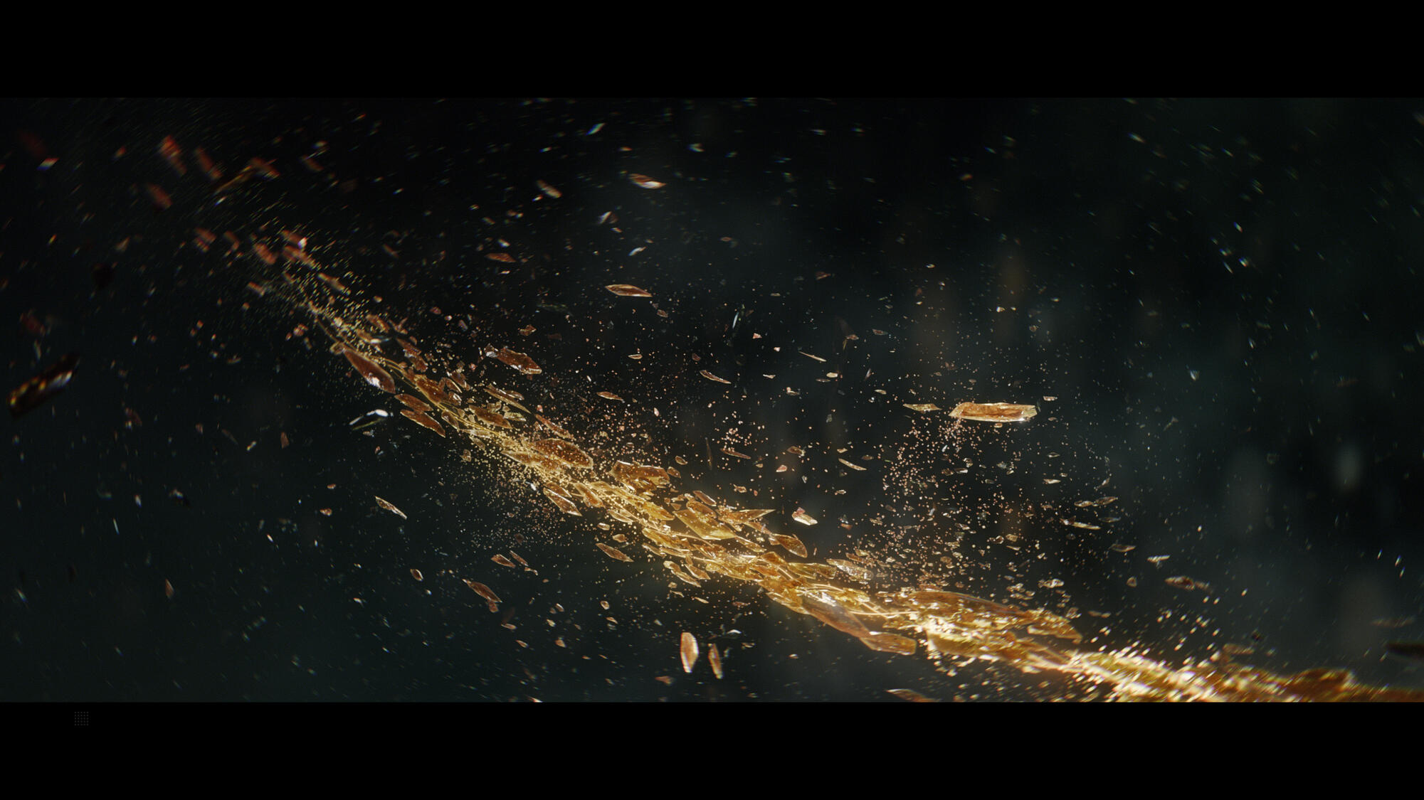 Abstrakcyjny obraz z ciemnym tłem i strumieniem złotych odłamków i cząsteczek poruszających się po przekątnej.