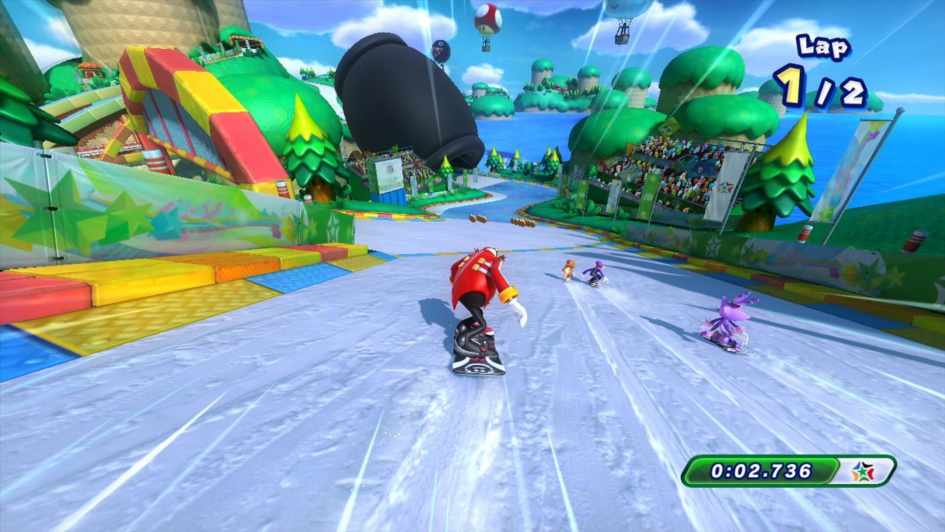 Una scena di gioco di snowboard. Il Dr. Eggman guida su una tavola, seguito da due personaggi. Un cannone e una pista colorata sono visibili.