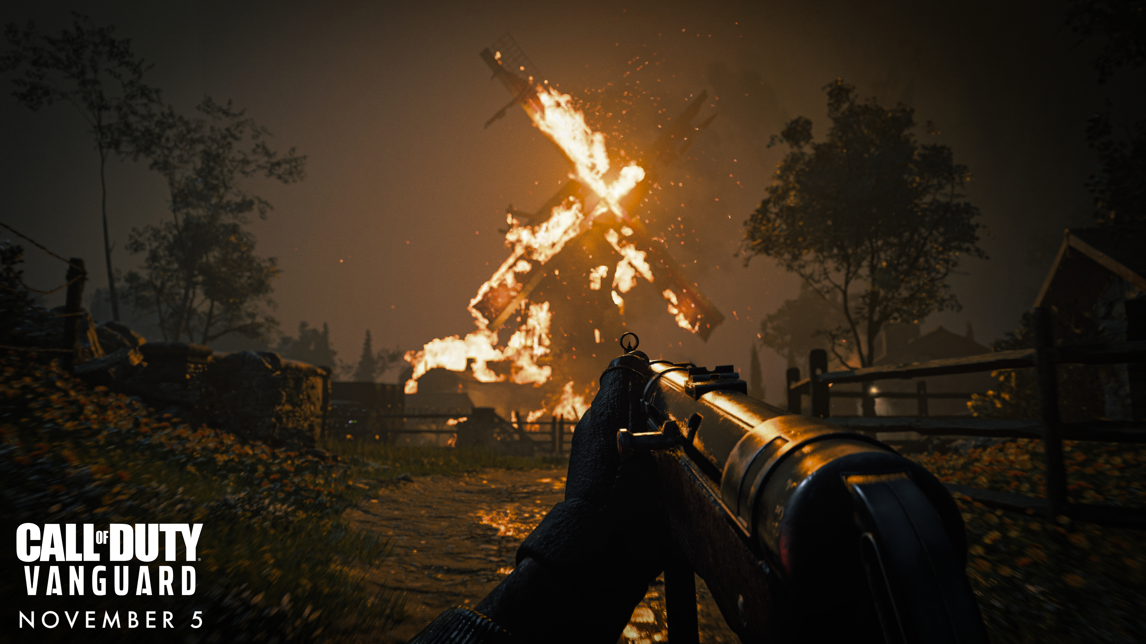 Una visuale in prima persona di un fucile puntato contro una struttura in fiamme. Viene pubblicizzato il gioco Call of Duty: Vanguard.