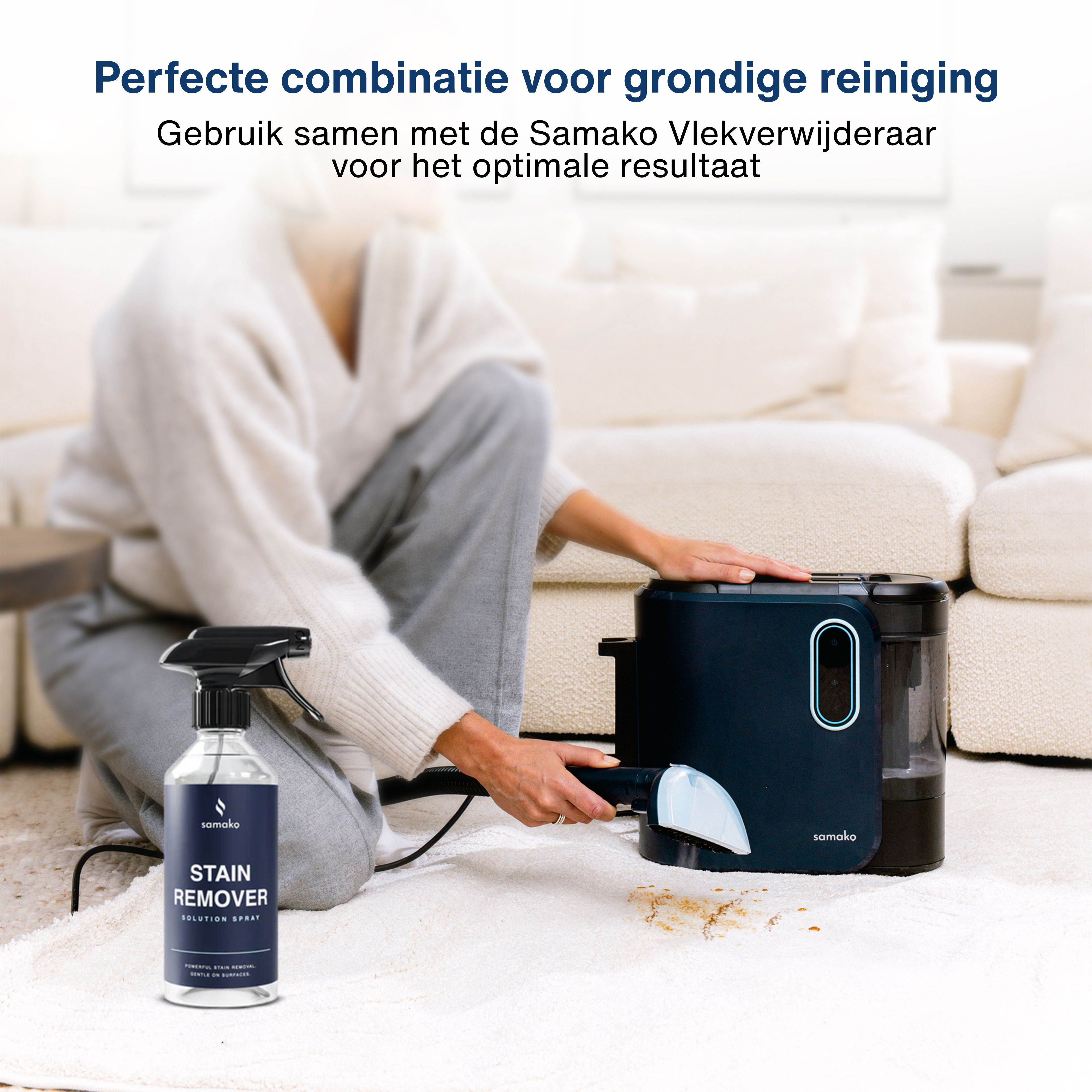 A woman uses a stain remover on a carpet. A spray bottle and a cleaning machine are visible. White carpet and sofa.
