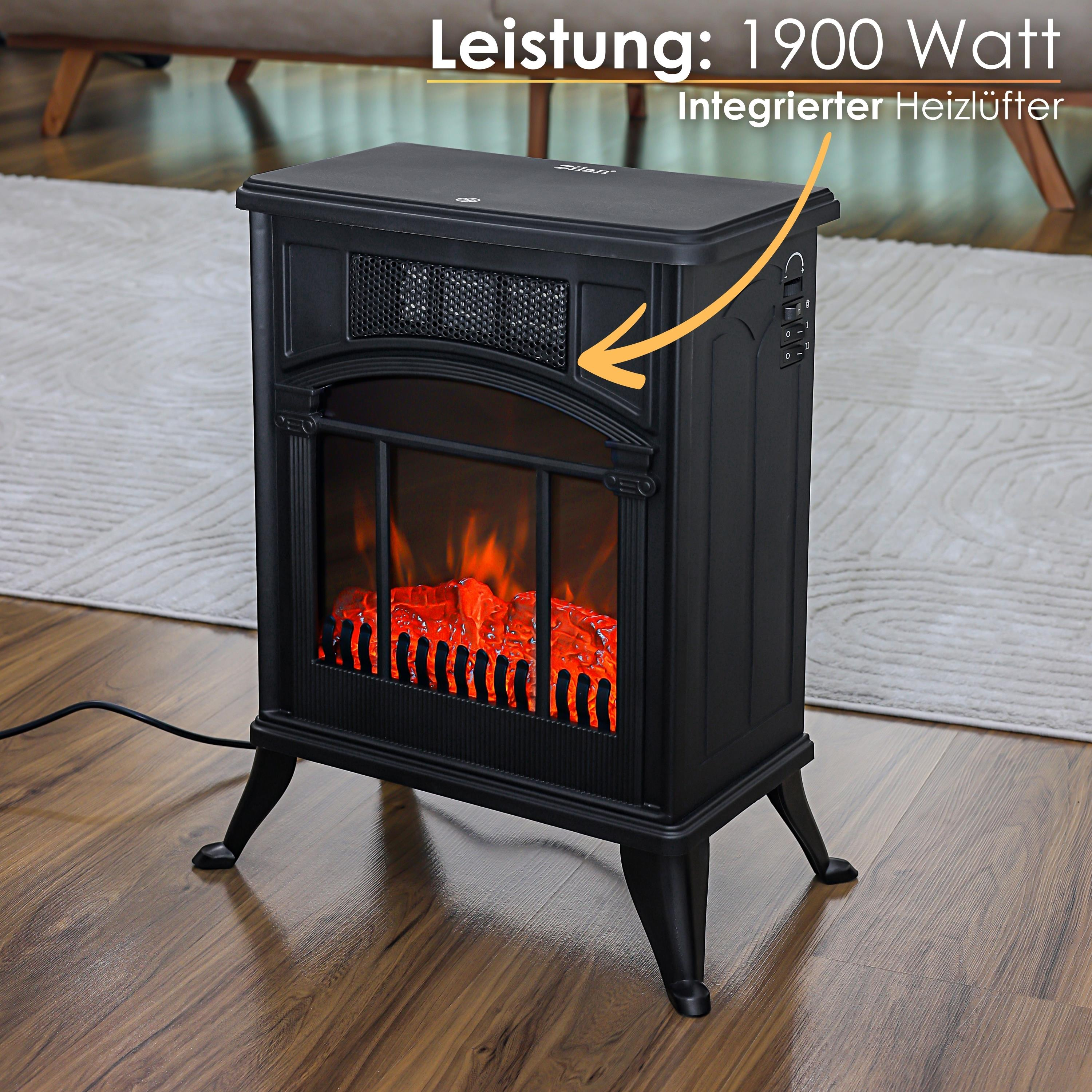 Ein schwarzer elektrischer Kamin mit Flammeneffekt steht auf einem Holzboden. Im Hintergrund ein Teppich und eine Couch.