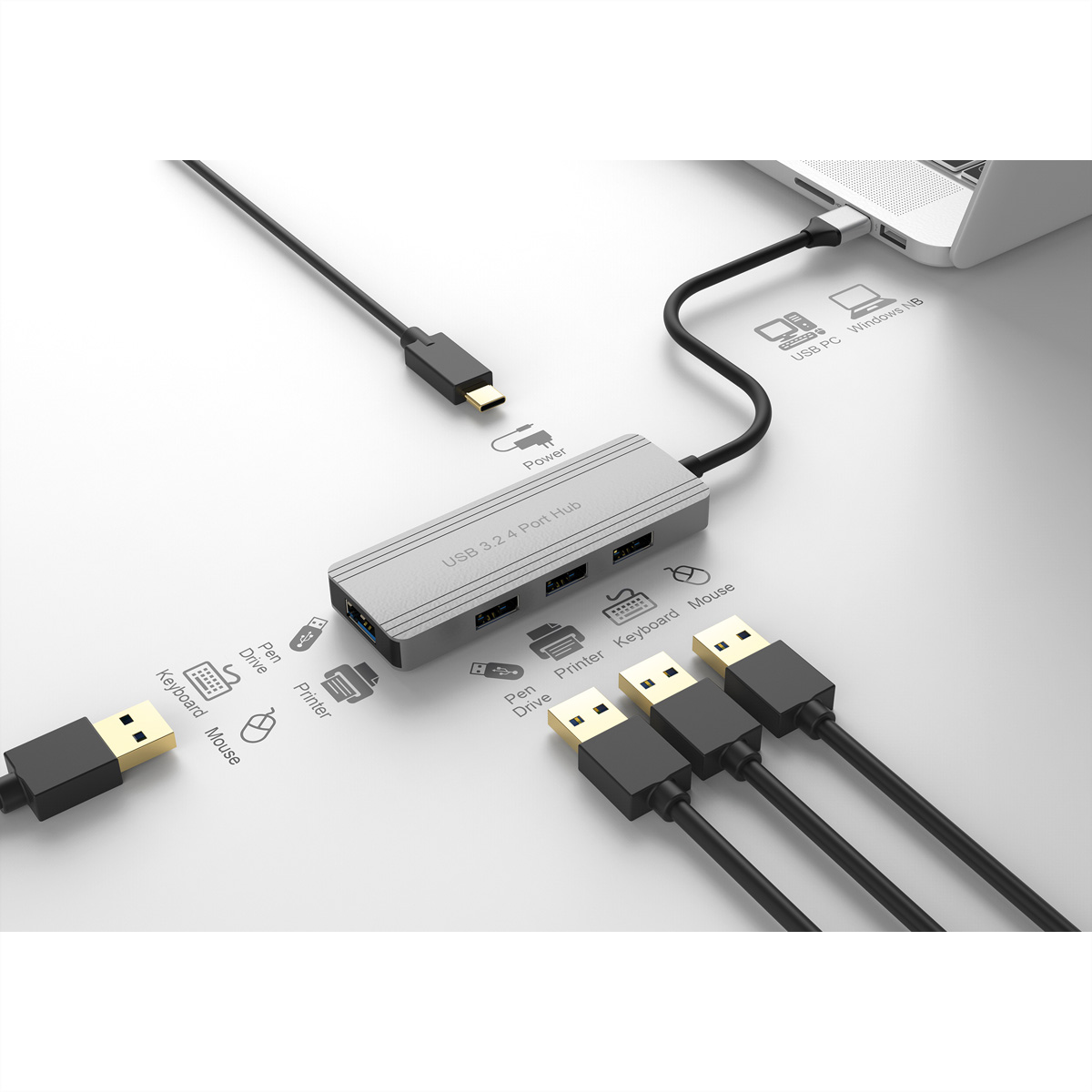Un hub USB 3.2 a 4 porte argentato è collegato a un laptop. Cavi con connettori USB sono collegati all'hub.