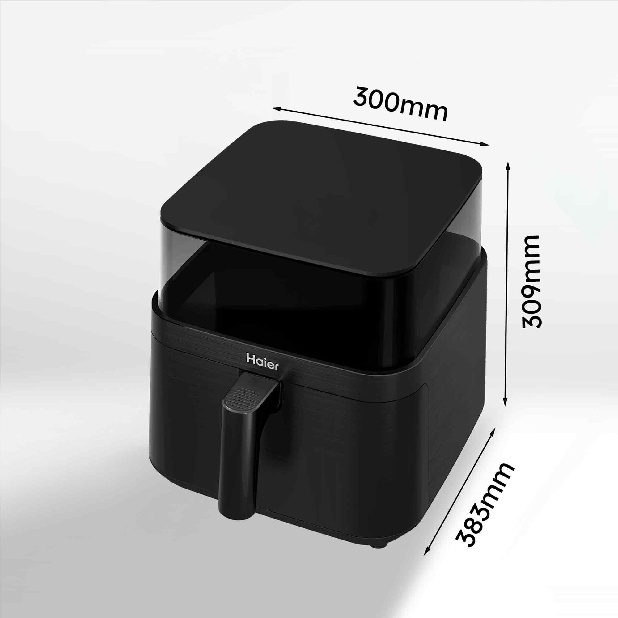 Se muestra una freidora de aire Haier negra con dimensiones etiquetadas. Fondo blanco. Asa a la izquierda.