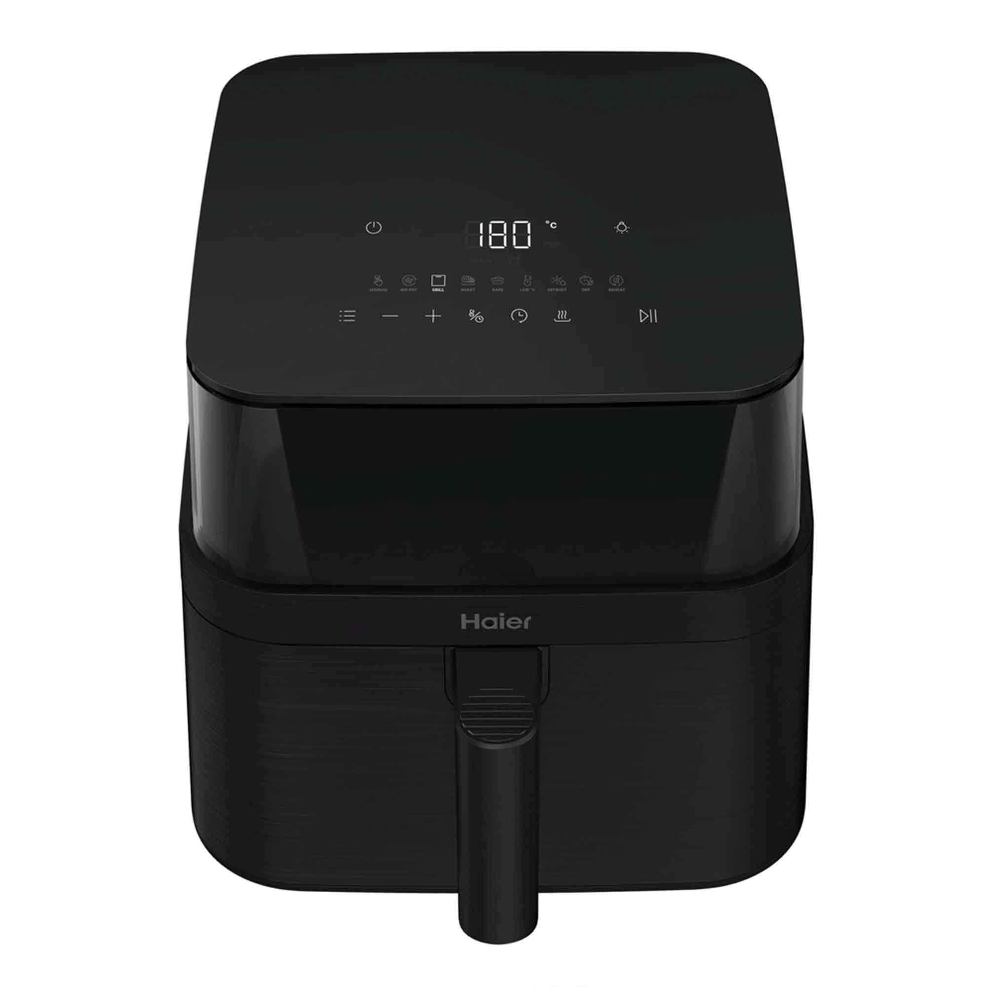 Freidora de aire Haier negra. La parte superior tiene una pantalla digital que muestra 180 grados. Panel de control con iconos. Asa frontal.