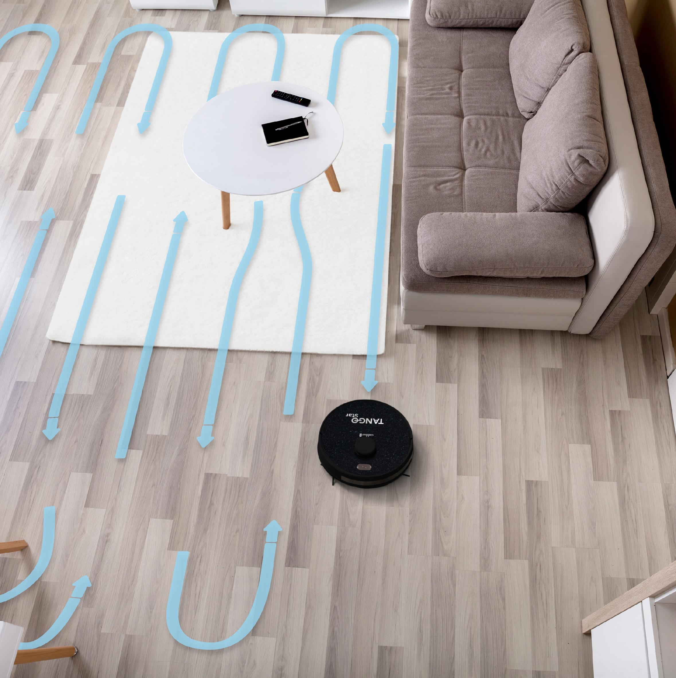 Robot sprząta pokój. Niebieskie strzałki wskazują trasę sprzątania. Jest też sofa i stół.