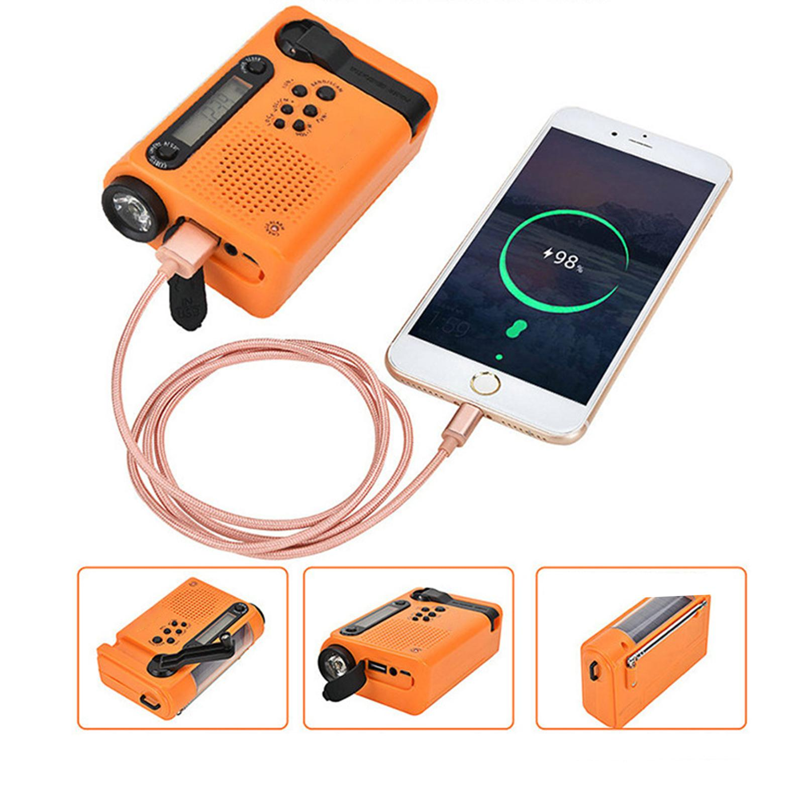 Ein orangefarbenes Handkurbelradio und ein Smartphone sind mit einem Kabel verbunden. Das Telefon zeigt ein Ladesymbol.