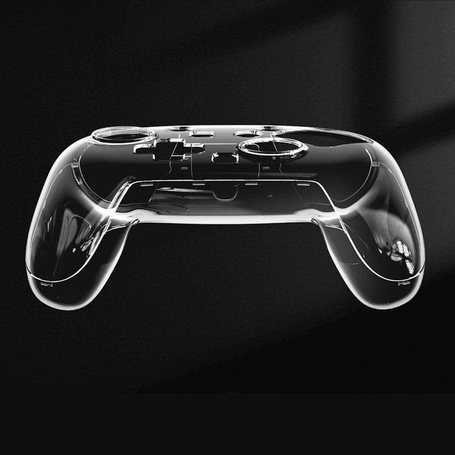Una cubierta transparente de plástico para el mando del juego sobre un fondo negro. La cubierta está moldeada para adaptarse a un mando.