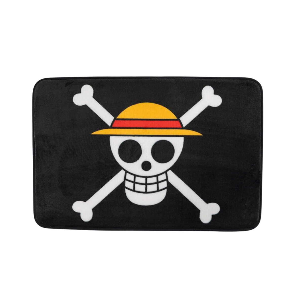 Un tapis noir avec un crâne blanc et des os croisés portant un chapeau jaune avec une bande rouge.