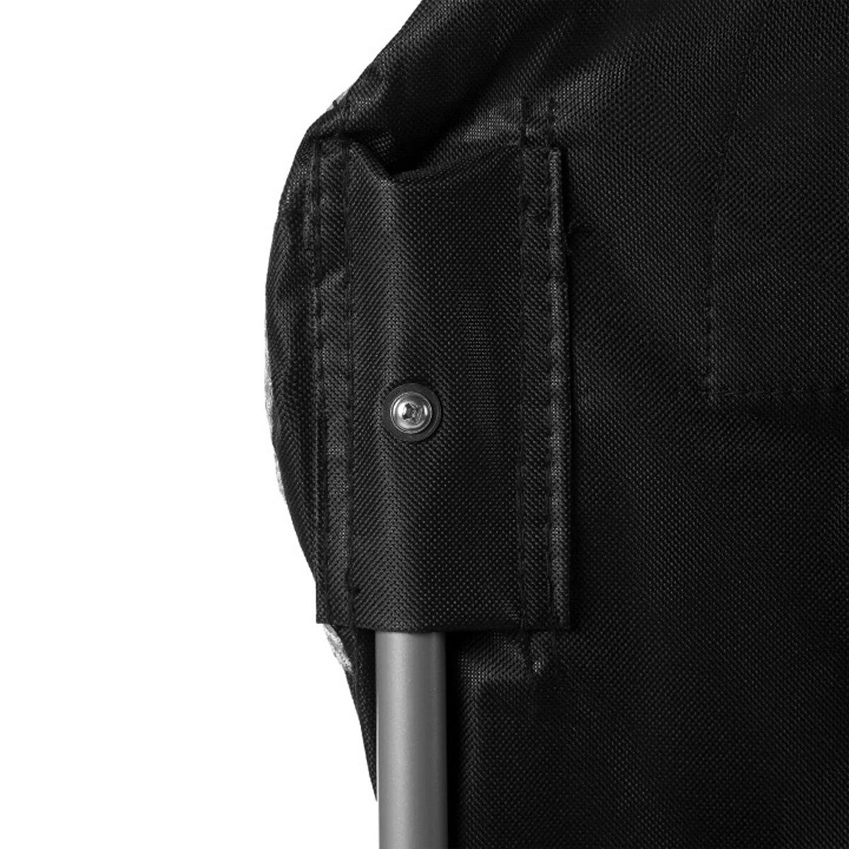 Close-up of black fabric with a metal pole and a silver screw. The fabric appears to be part of a larger structure.