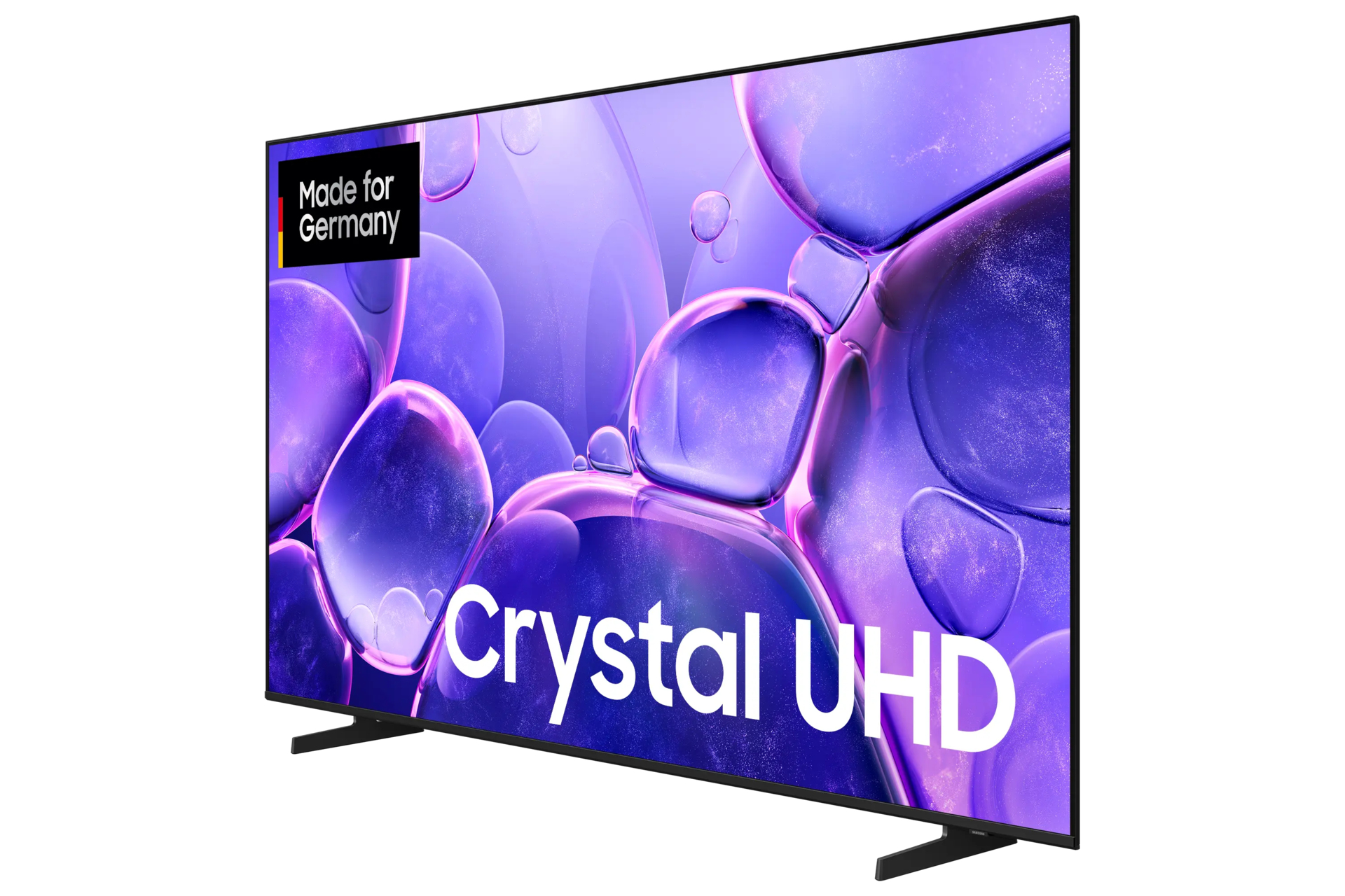 Telewizor Samsung Crystal UHD. Ekran wyświetla fioletowe bąbelki. Naklejka 'Made for Germany' w lewym górnym rogu. Czarny stojak.