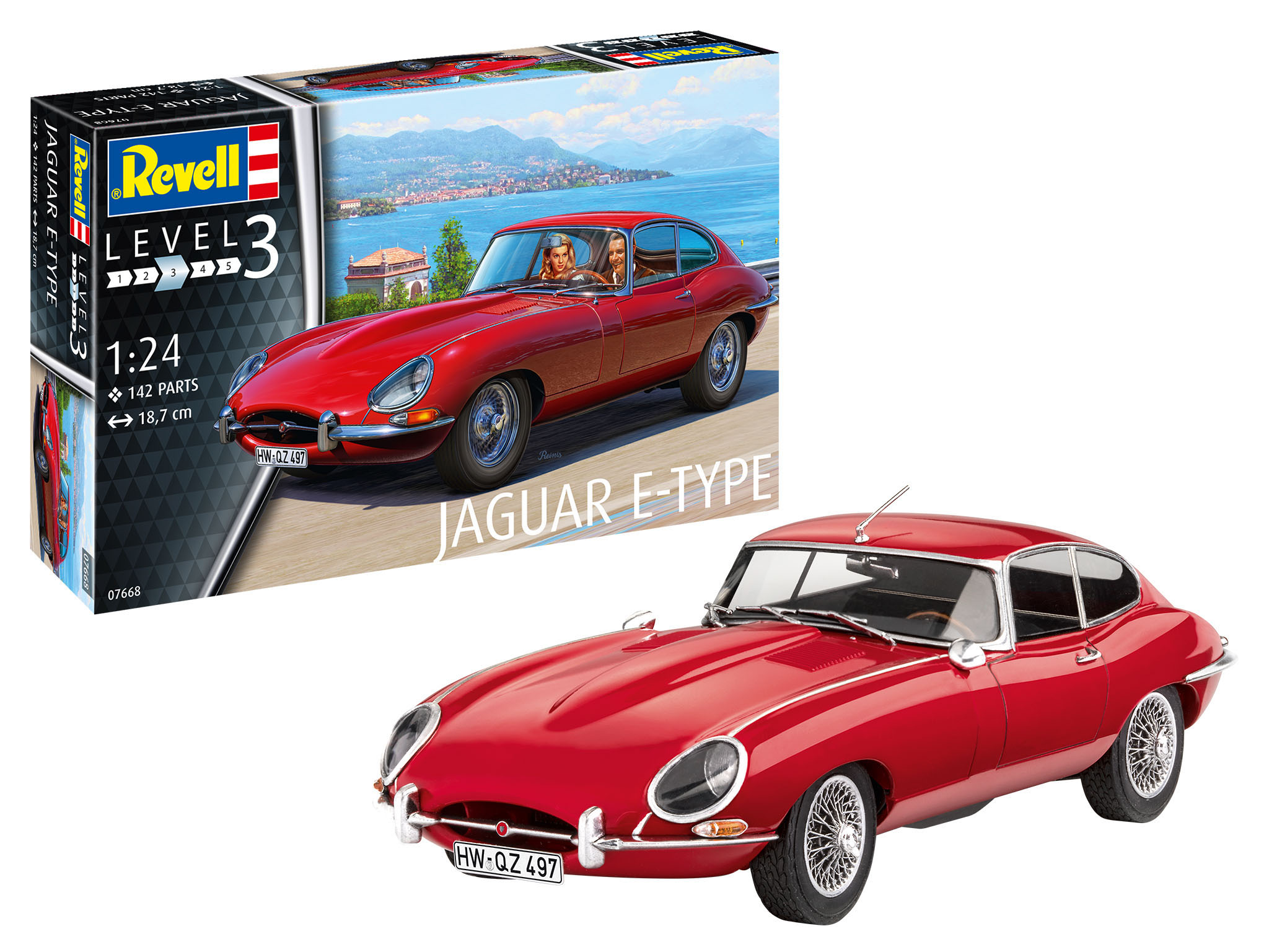 Ein rotes Jaguar E-Type Modellauto neben seiner Schachtel. Die Schachtel zeigt ein Auto mit Personen darin.