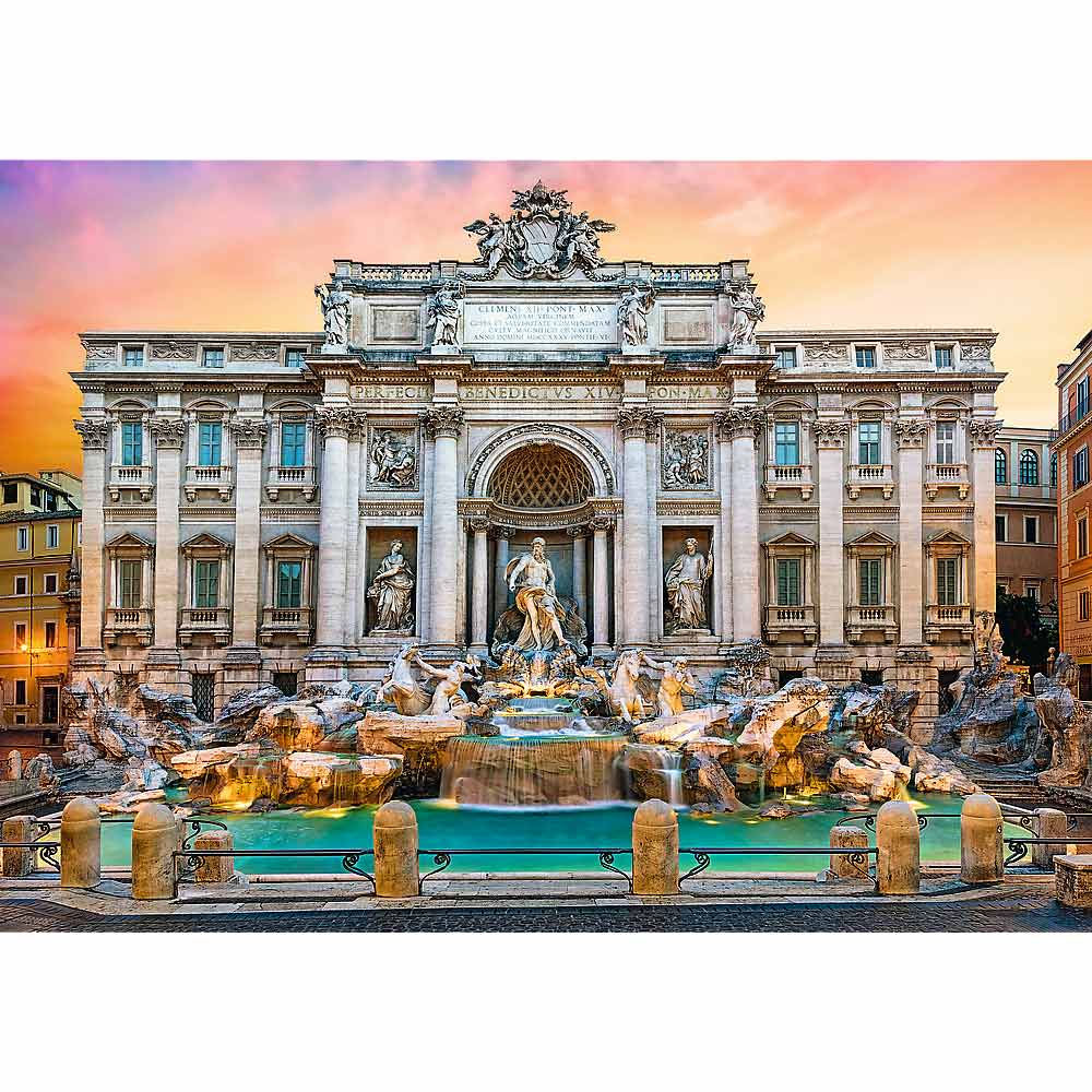 La Fontana di Trevi a Roma. Una grande fontana barocca con sculture, acqua a cascata e un cielo colorato al tramonto.