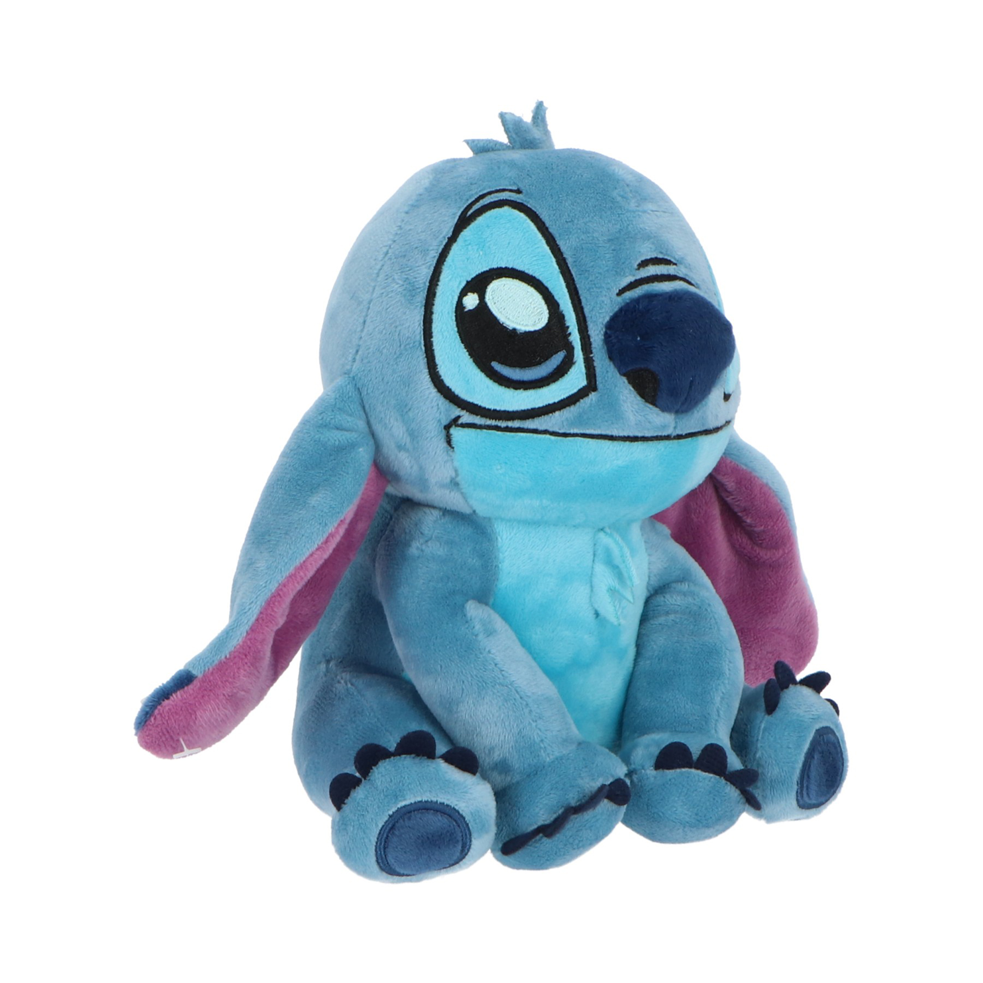 Un peluche di Stitch blu con grandi orecchie, grandi occhi e piedi blu scuro, su sfondo bianco.
