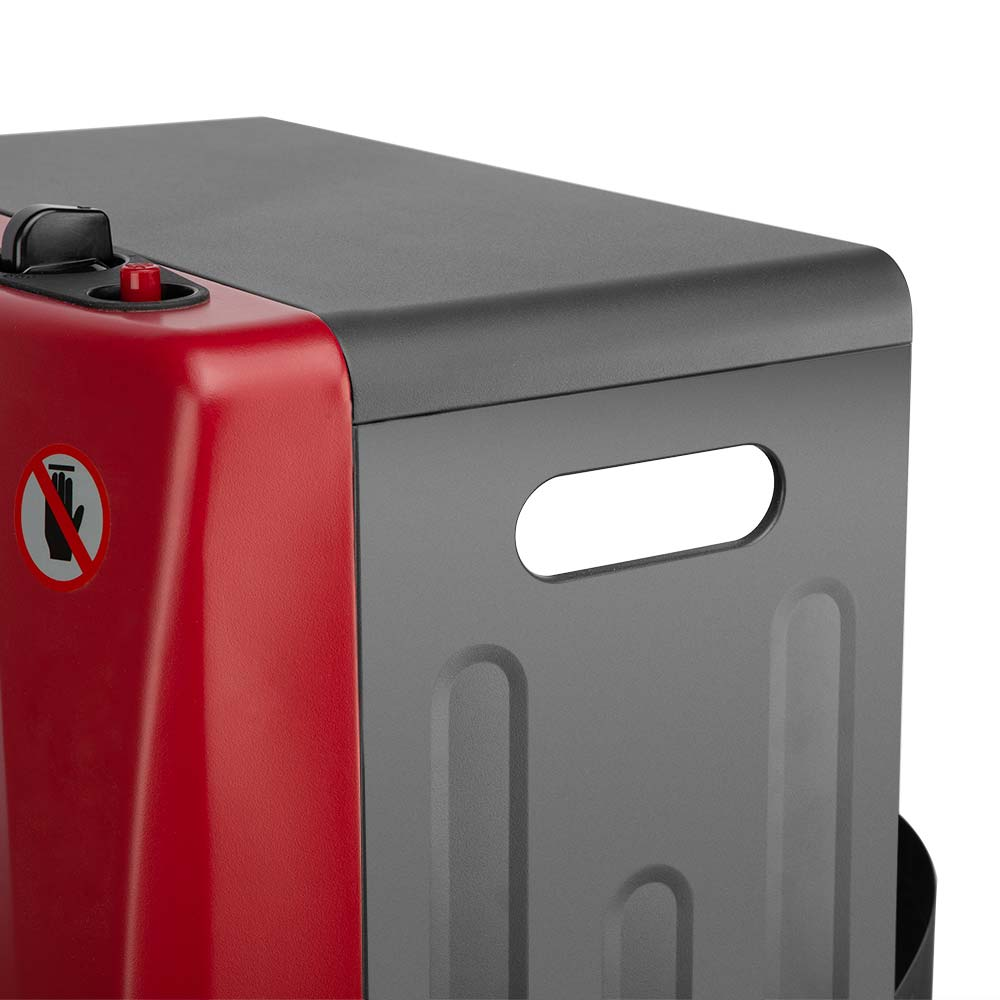 Primer plano de una máquina roja y gris. Tiene un asa, un símbolo de advertencia y una ranura. Los colores son rojo, gris y negro.
