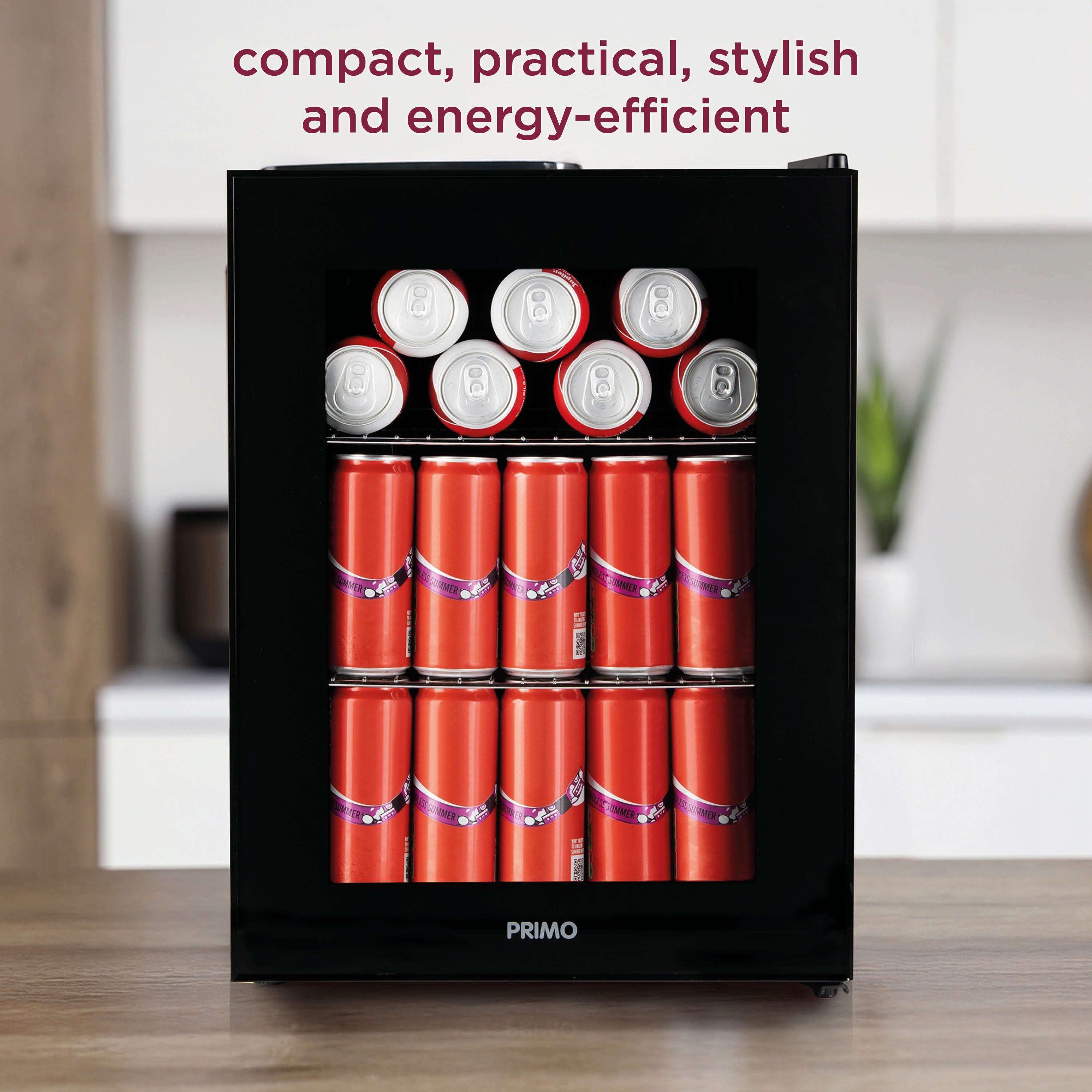 A black mini-fridge filled with red cans. Text above reads: compact, practical, stylish, and energy-efficient.