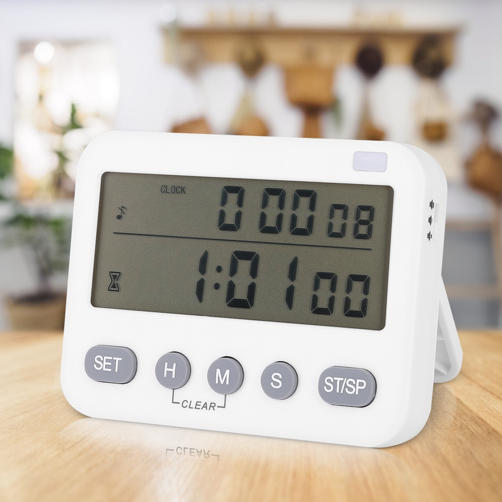 Ein weißer digitaler Küchentimer zeigt 0:00:08 und 1:01:00 an. Tasten sind SET, H, M, S und ST/SP. Der Timer steht auf einer Holzoberfläche.