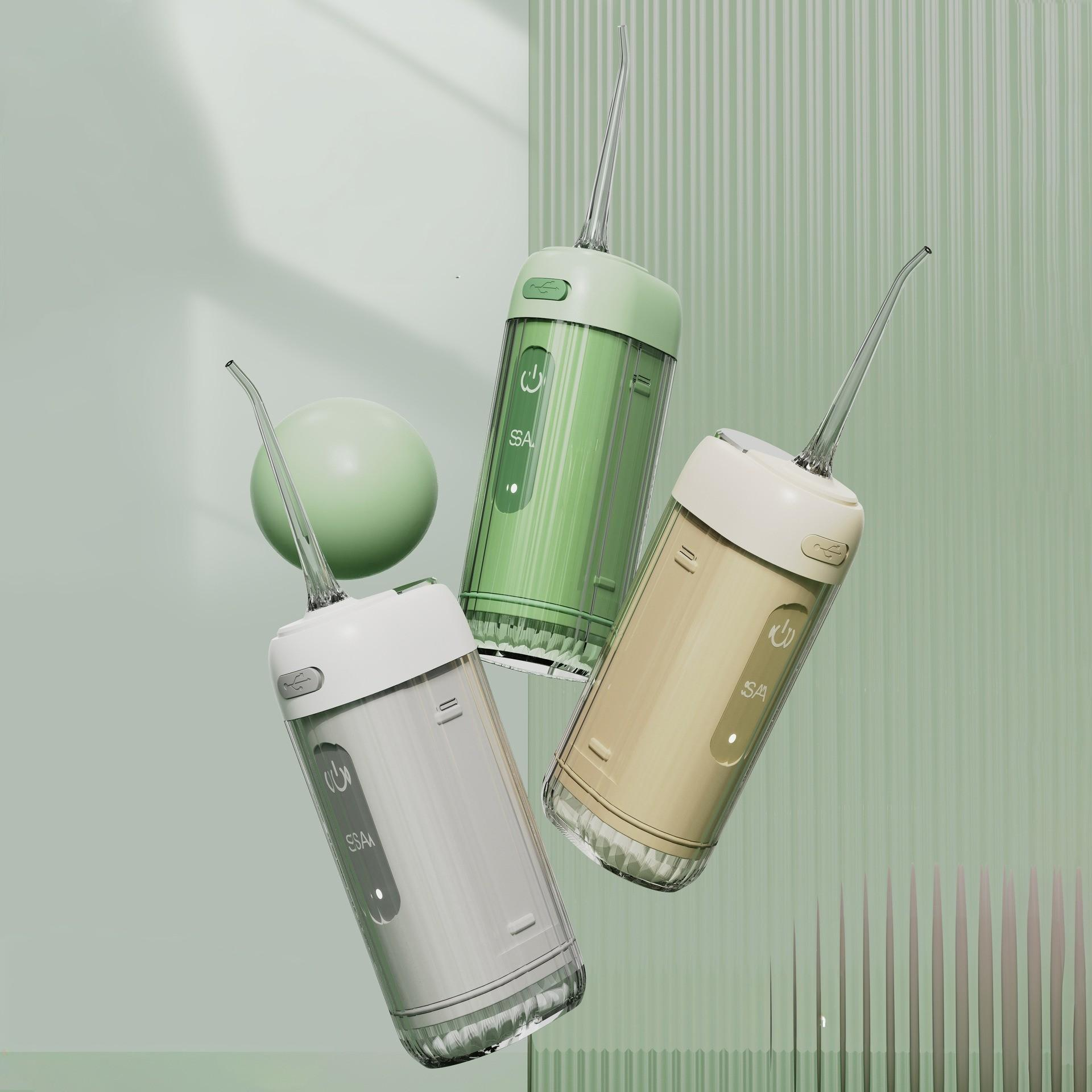 Drei Zahnwasser-Flosser in Grün, Beige und Grau. Im Hintergrund ist eine grüne Kugel. Der Hintergrund ist hellgrün.