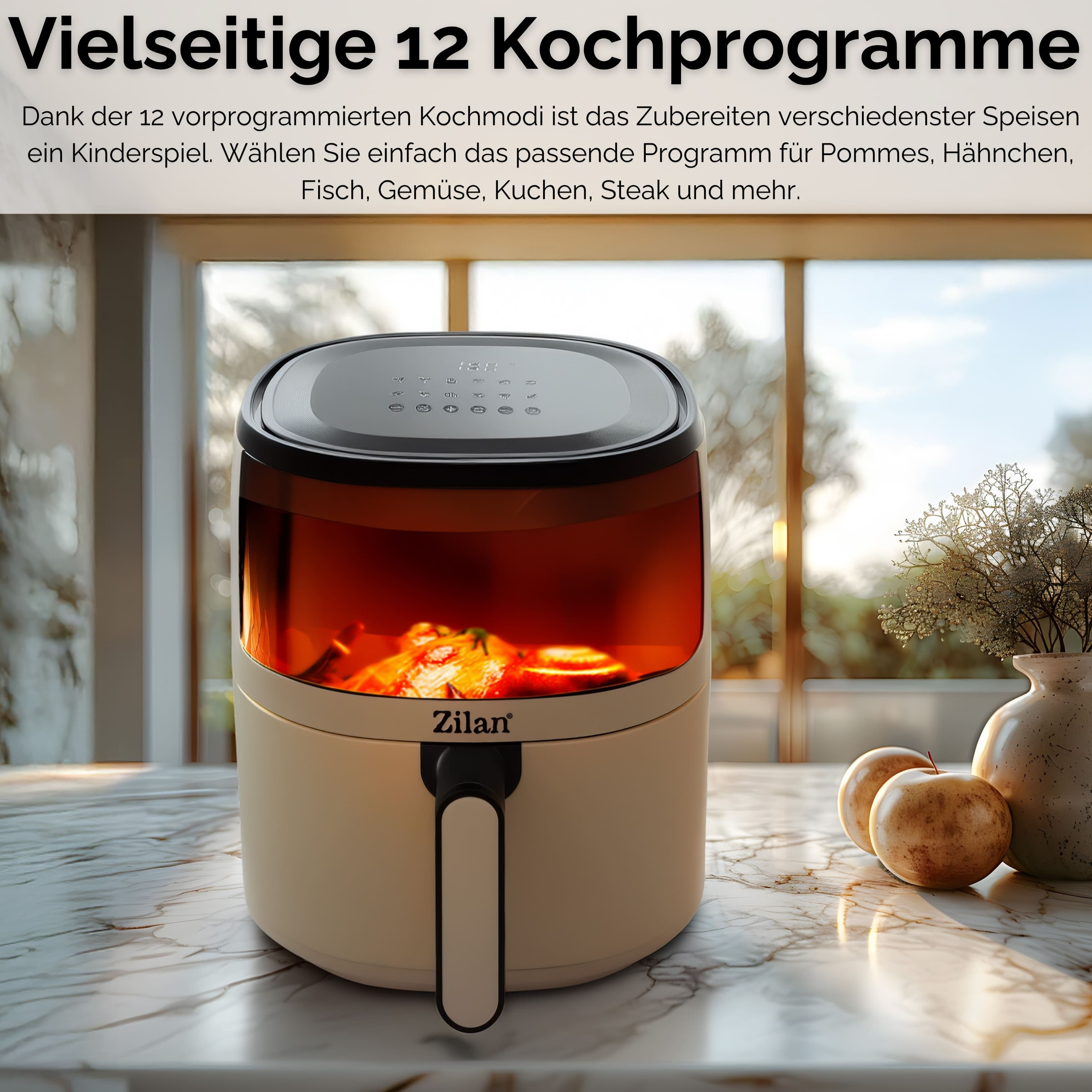 Ein Luftfritteuse auf einer Marmoroberfläche. Im Hintergrund Äpfel, eine Vase und ein Fenster.