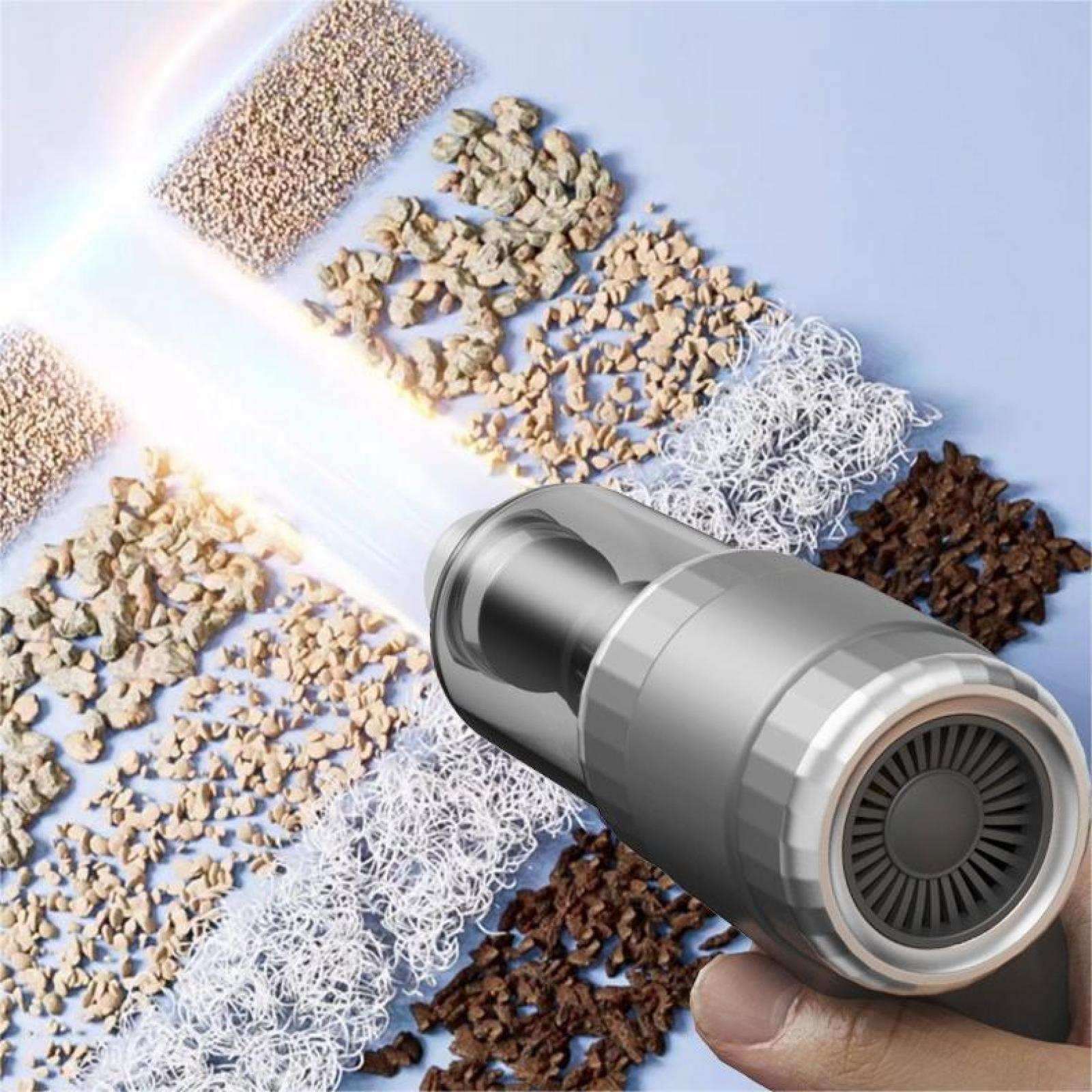Ein Handstaubsauger wird über Proben verschiedener Materialien gehalten, wobei Lichtstrahlen die Szene hervorheben.