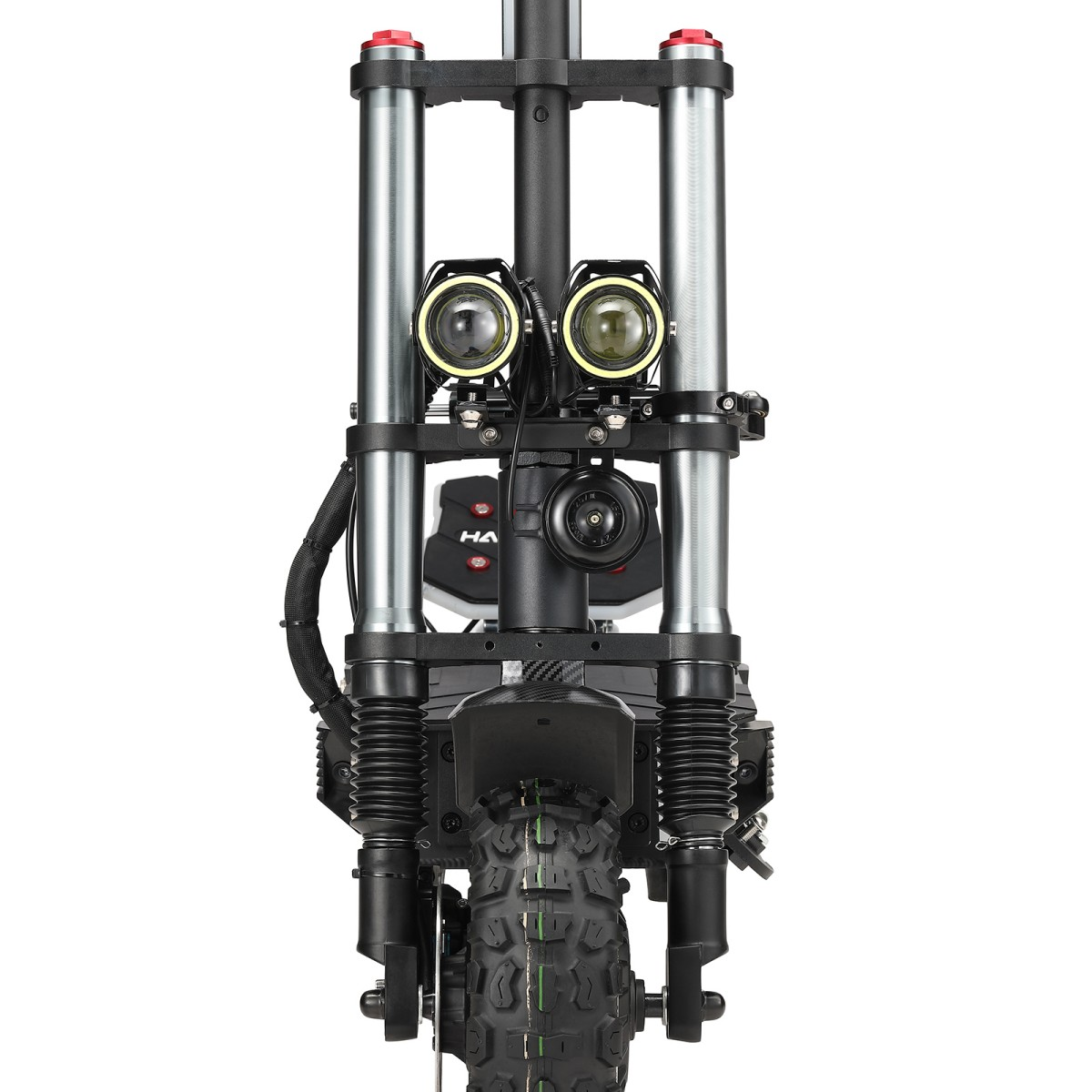 Widok z przodu hulajnogi elektrycznej. Ma dwa reflektory, czarną oponę i system zawieszenia. Hulajnoga jest czarna i srebrna.