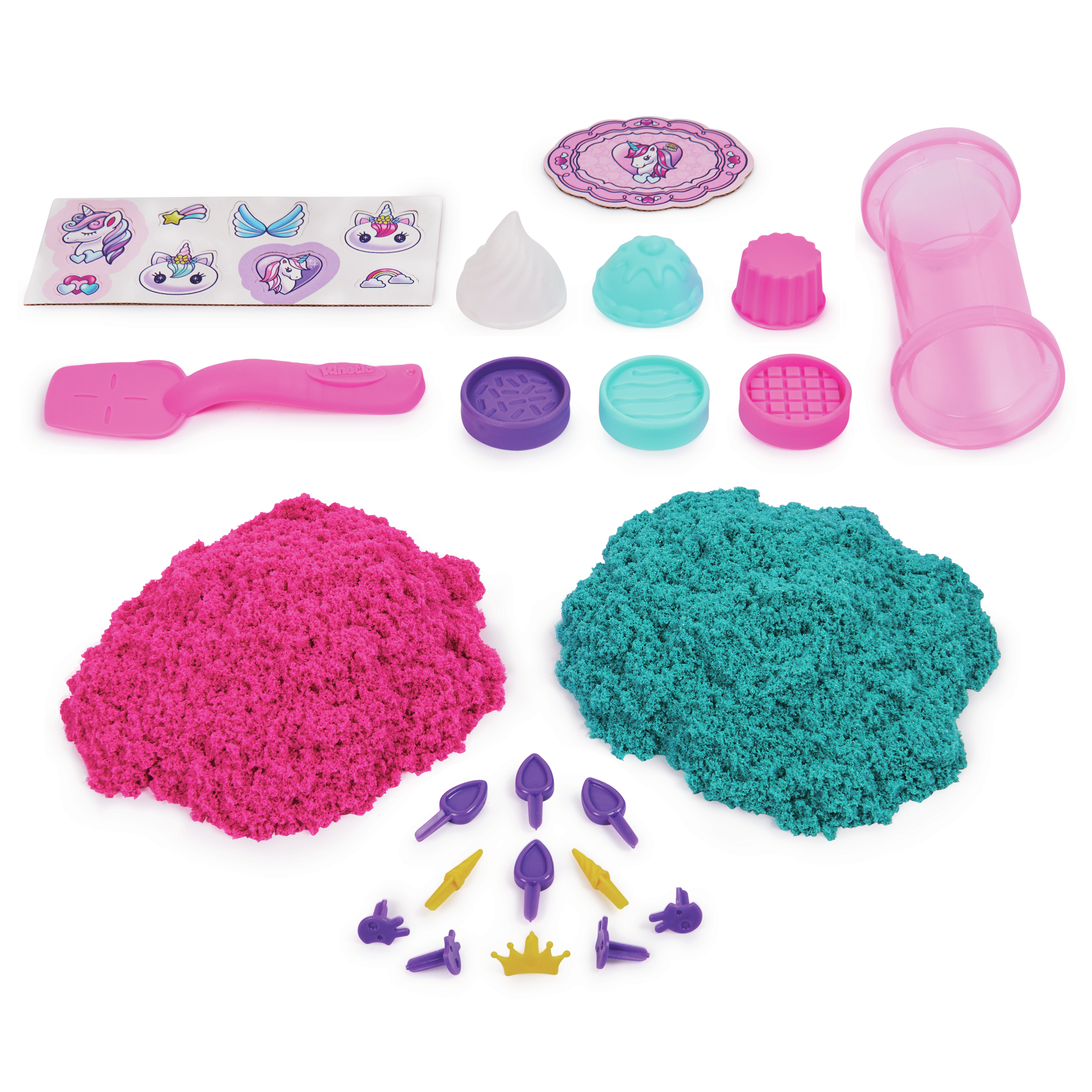 Un kit con arena rosa y verde azulado, moldes, pegatinas y herramientas. Incluye unicornios, una corona y herramientas con forma.