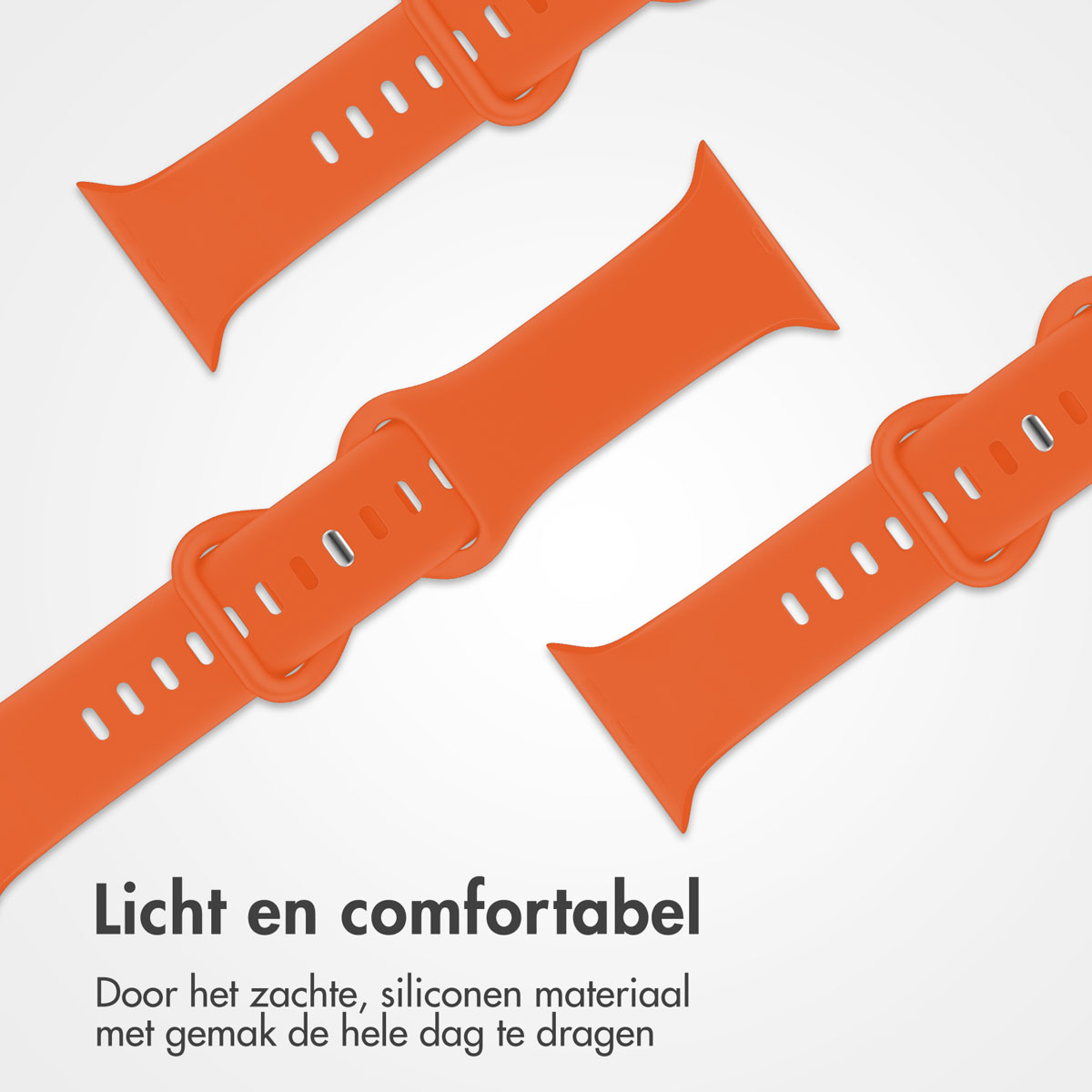 Drie oranje horlogebandjes worden diagonaal op een witte achtergrond weergegeven. Elke band heeft een gesp en meerdere verstelgaten.